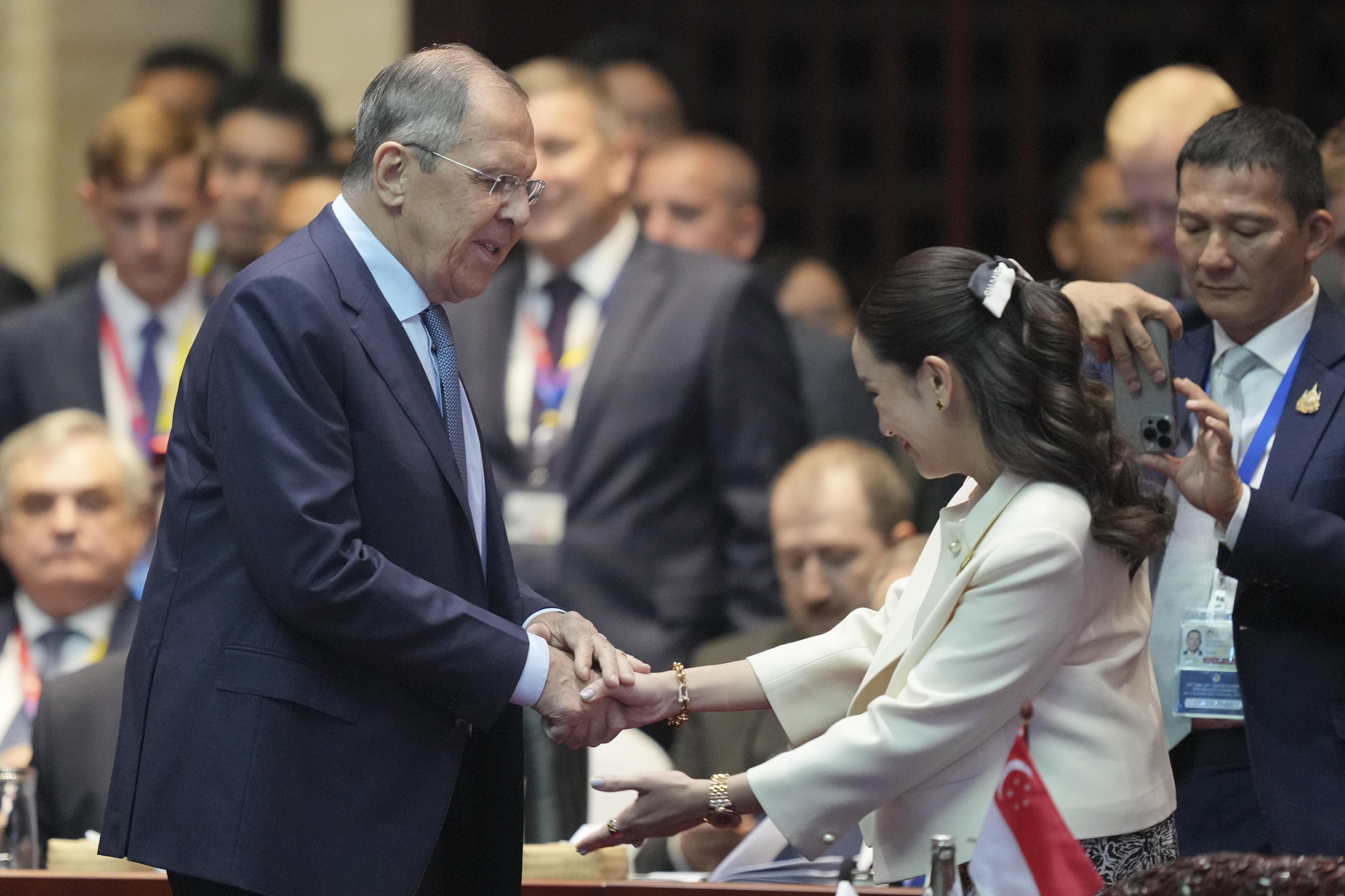 Russian Foreign Minister Sergey Lavrov, left, shakes hands with Thailand's Prime Minister Paetongtarn Shinawatra during the 19th East Asia Summit in Vientiane, Laos, Friday, Oct. 11, 2024. (AP Photo/Dita Alangkara)