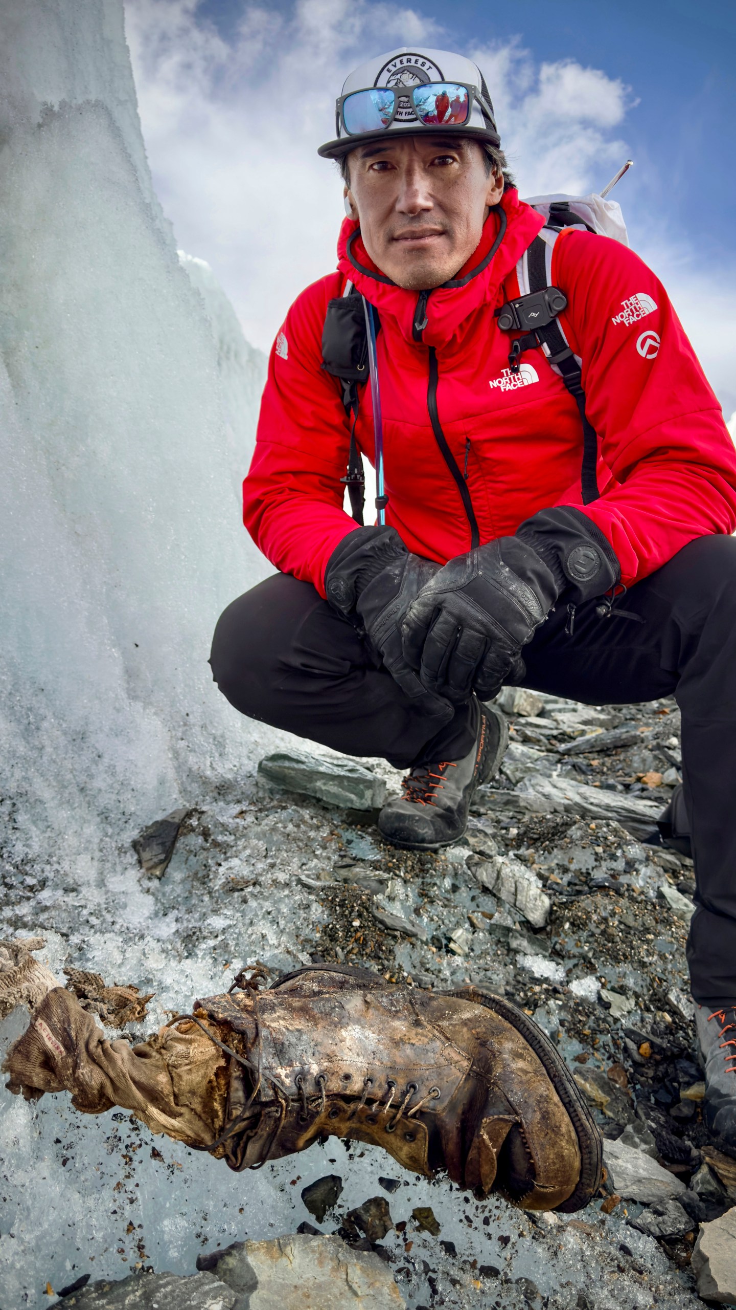 In this photo provided by National Geographic on Friday, Oct. 11, 2024, a view of a sock embroidered with "A.C. Irvine", along with a boot, discovered on the Central Rongbuk Glacier below the North Face of Mount Everest by a team led by Jimmy Chin. (Jimmy Chin/National Geographic via AP)