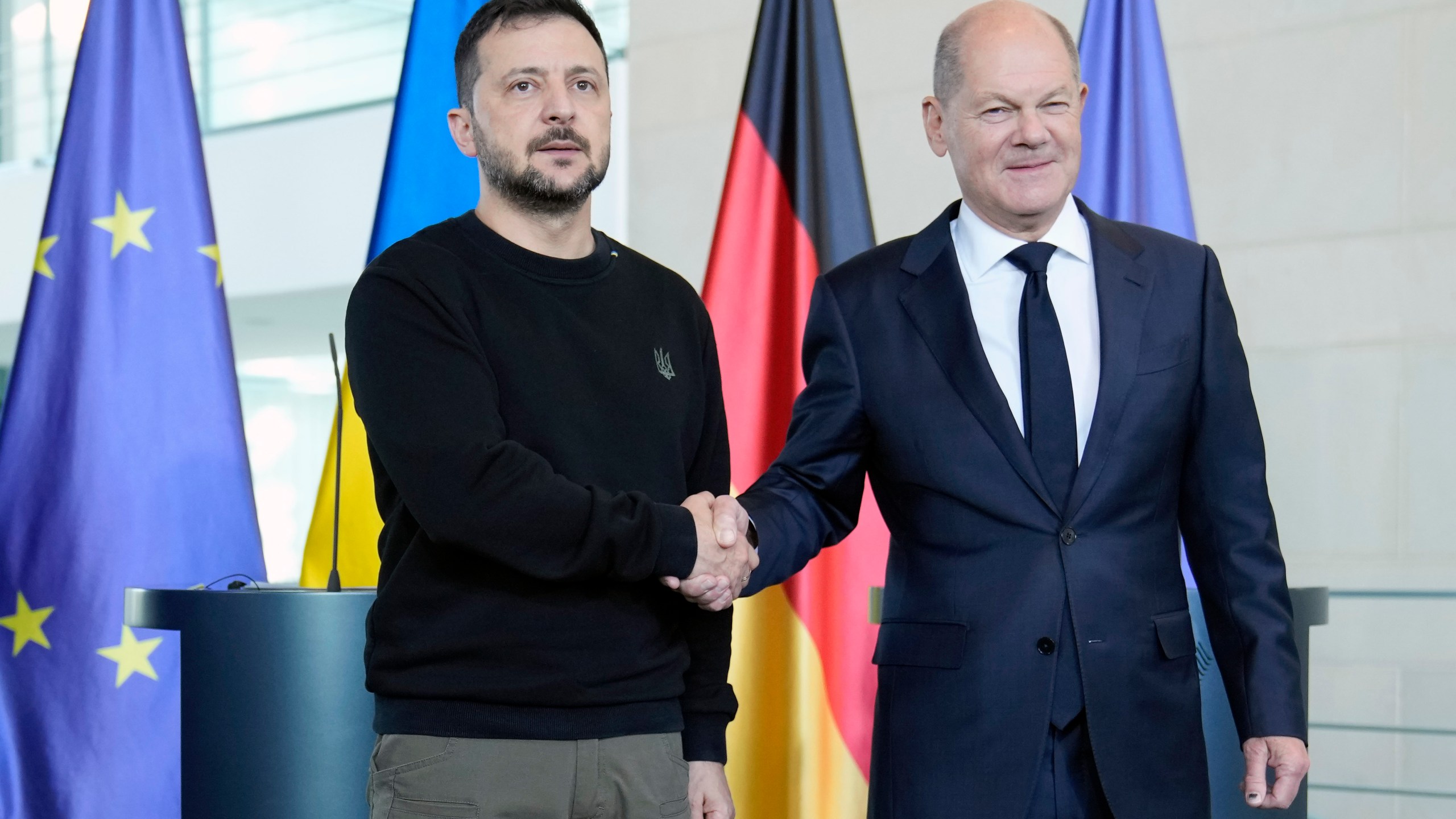 Ukraine's president Volodymyr Zelenskyy and German chancellor Olaf Scholz shake hands at the chancellery in Berlin, Germany, Friday, Oct. 11, 2024. (AP Photo/Ebrahim Noroozi)