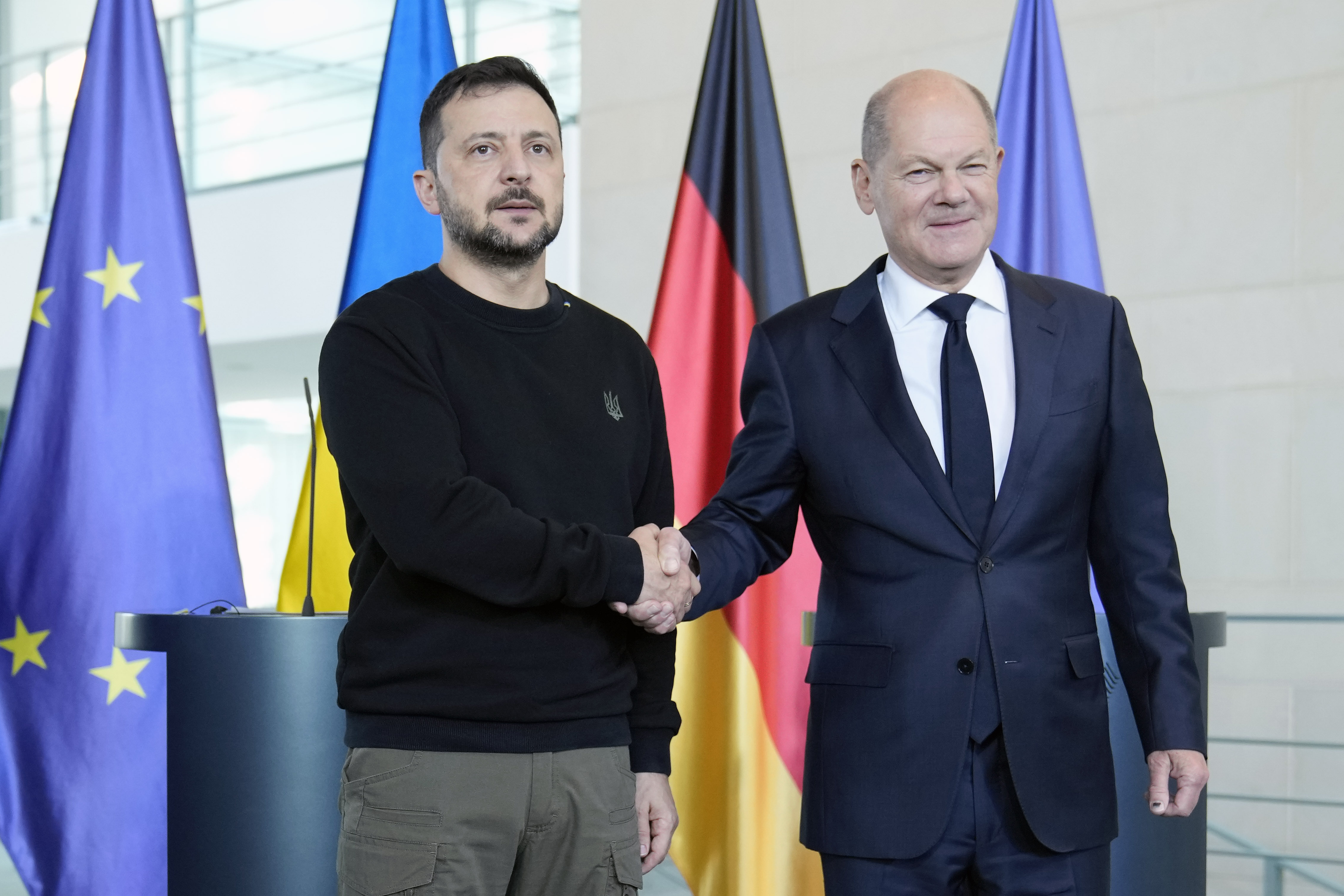 Ukraine's president Volodymyr Zelenskyy and German chancellor Olaf Scholz shake hands at the chancellery in Berlin, Germany, Friday, Oct. 11, 2024. (AP Photo/Ebrahim Noroozi)