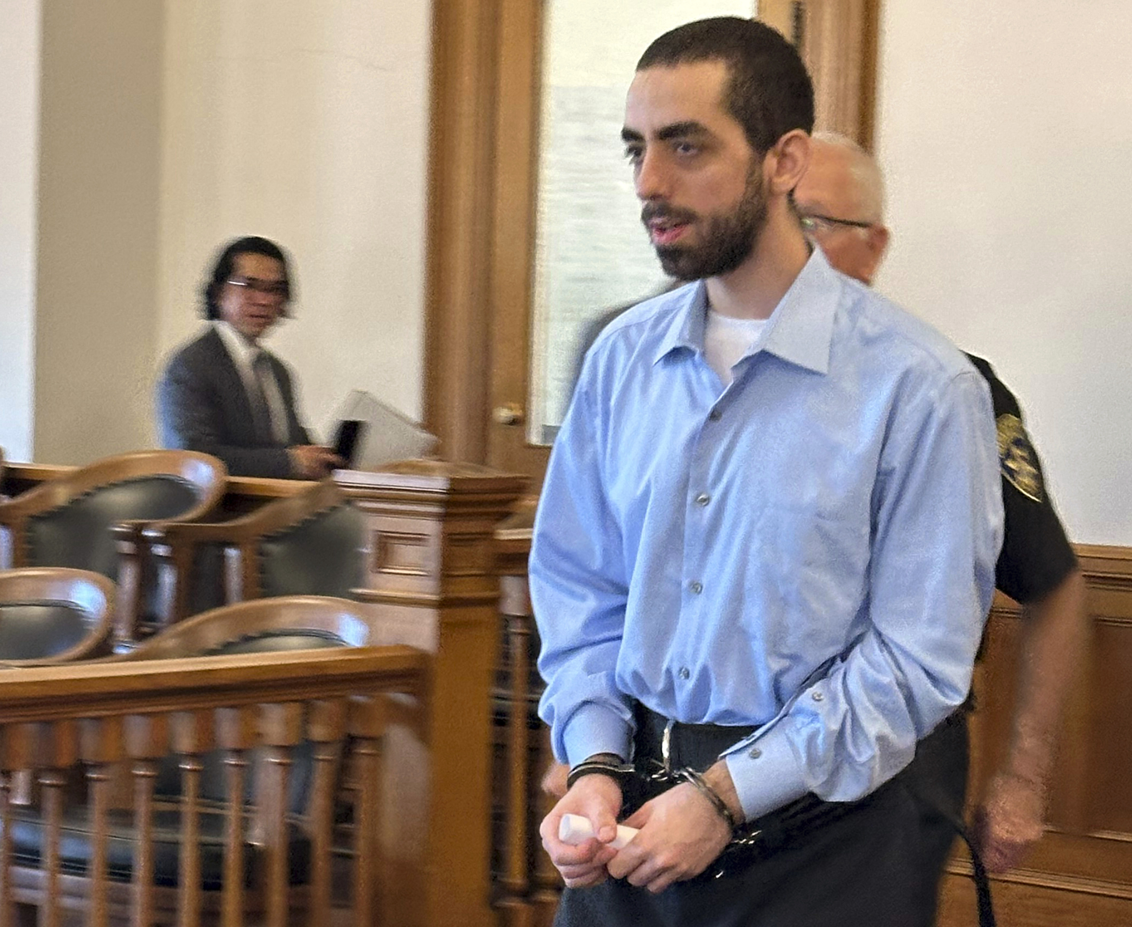 Had Matar, charged with attempted murder for stabbing author Salman Rushdie more than a dozen times, is escorted into the courtroom for a hearing in Chautauqua County Court, Friday, Oct. 4, 2024, in Mayville, N.Y. (AP Photo/Carolyn Thompson)