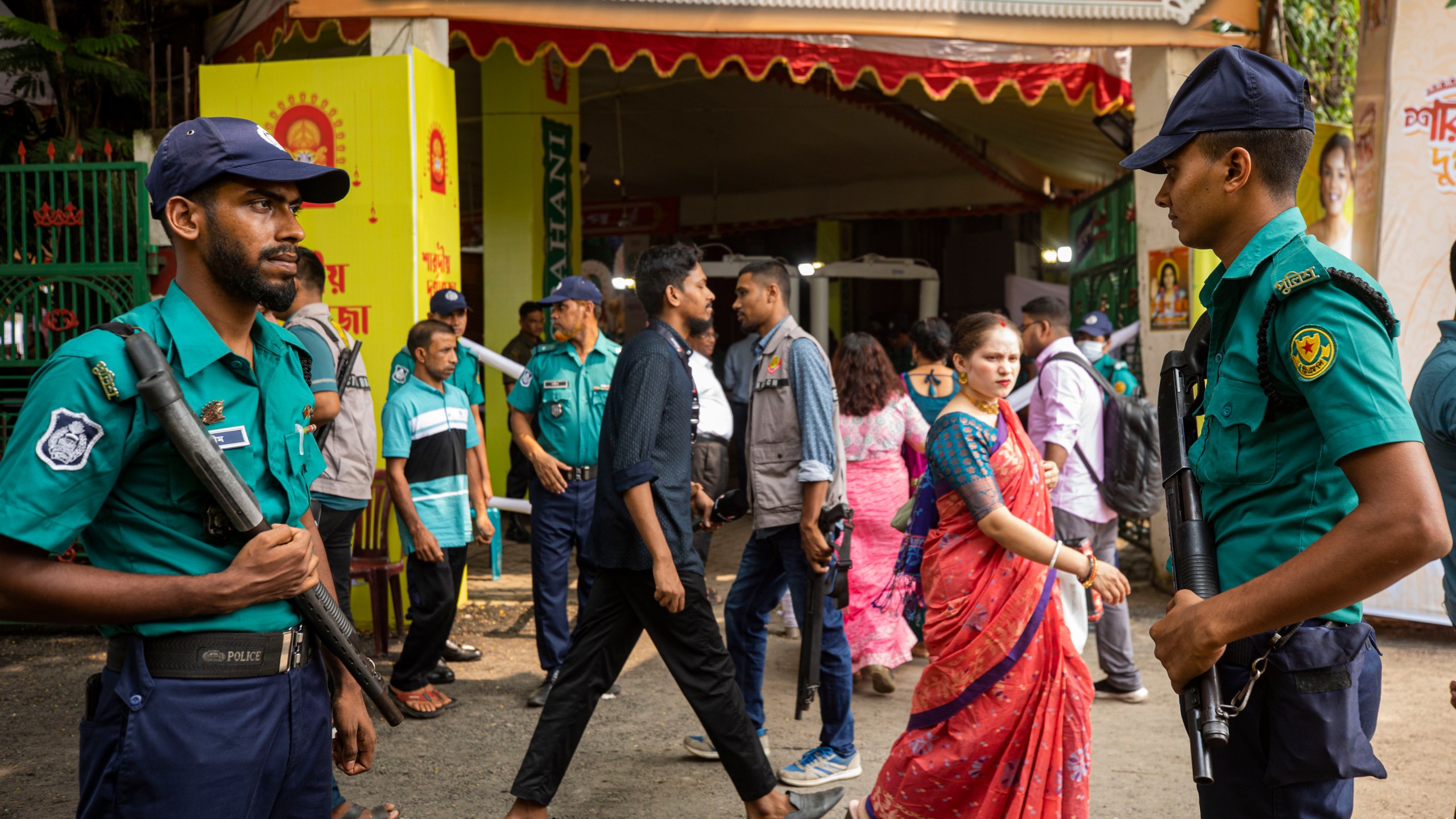 Policemen stand guard outside Dhakeshwari National Temple during the Durgapuja festival in Dhaka, Bangladesh, on Oct. 10, 2024. (AP Photo/Rajib Dhar)