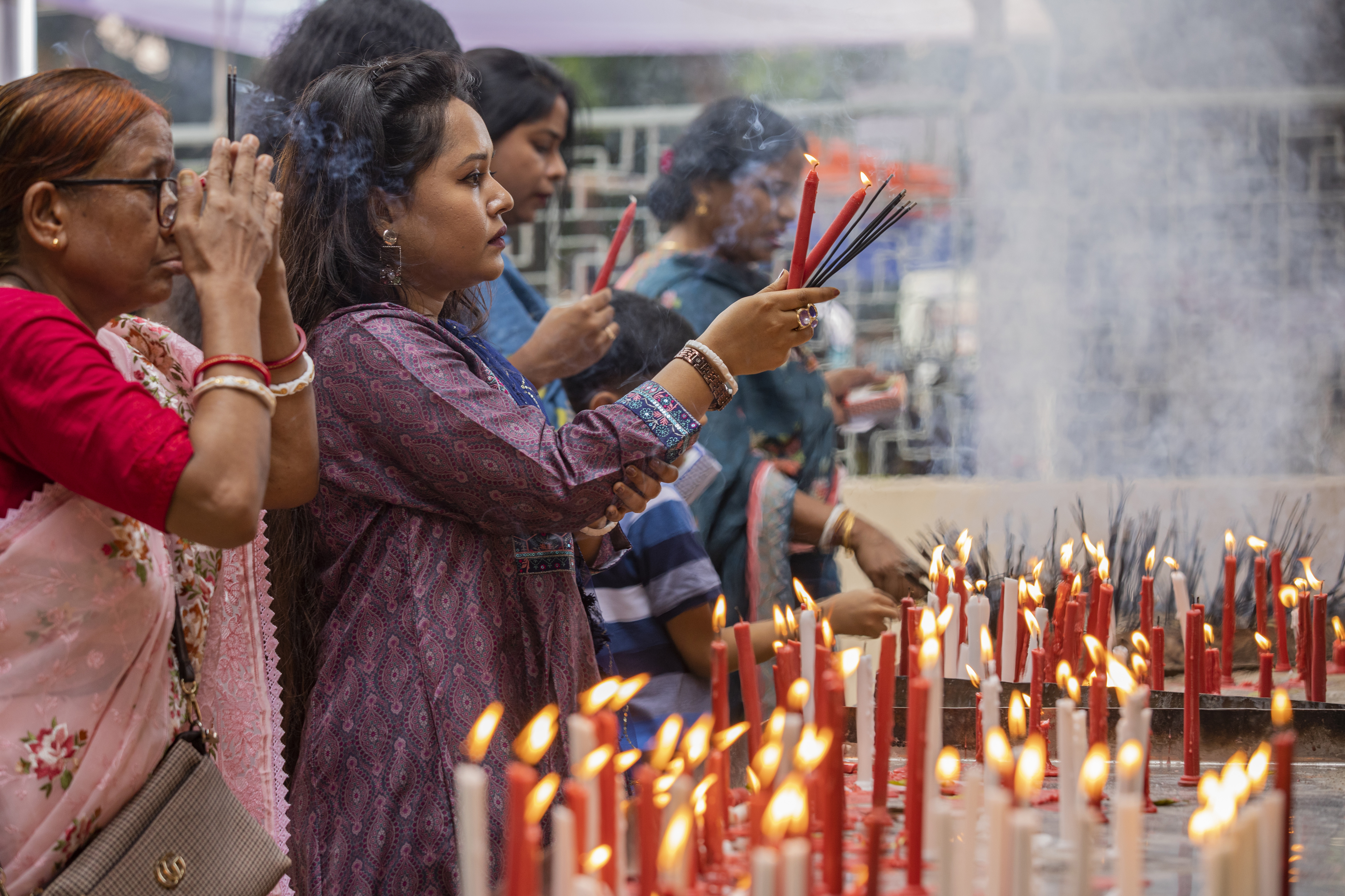 Hindu devotees offer prayers at the Dhakeshwari National Temple during the Durgapuja festival in Dhaka, Bangladesh, on Oct. 10, 2024. (AP Photo/Rajib Dhar)