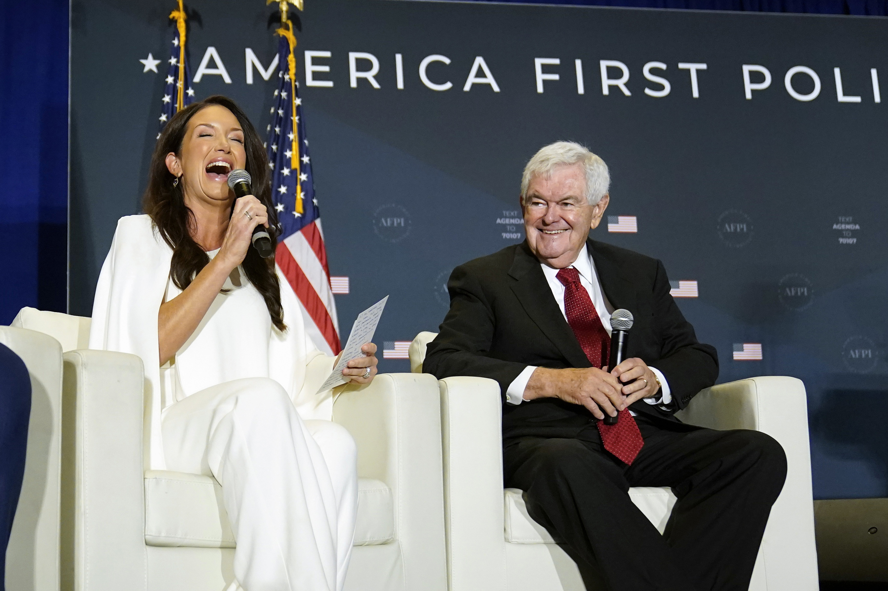 FILE - Brooke Rollins, former director of the White House Domestic Policy Council, speaks as former House Speaker Newt Gingrich listens at an America First Policy Institute agenda summit in Washington, July 26, 2022. (AP Photo/Andrew Harnik, File)