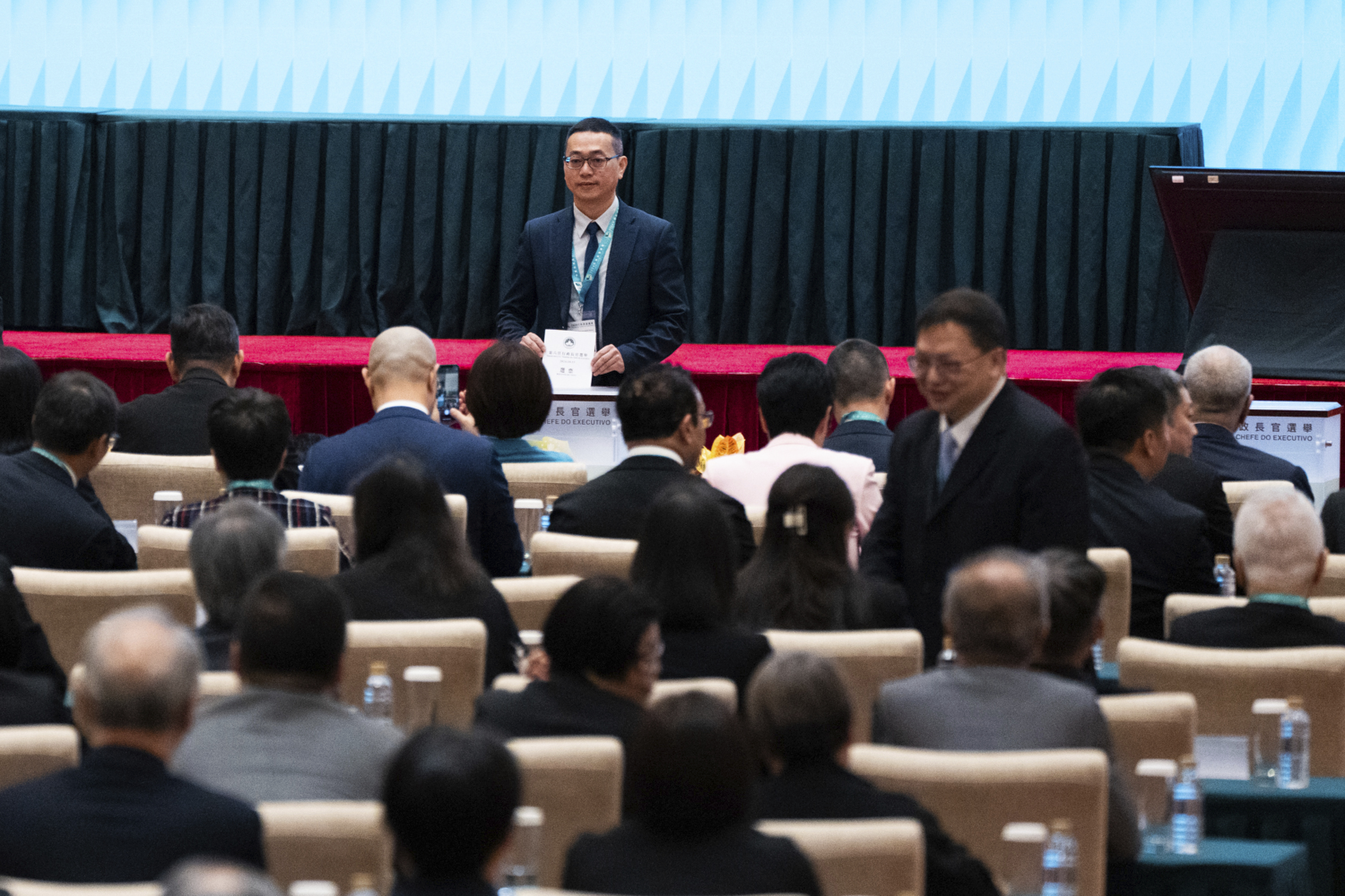 An election committee member votes during the chief executive election in Macao, Sunday, Oct. 13, 2024. (AP Photo/Bertha Wang)