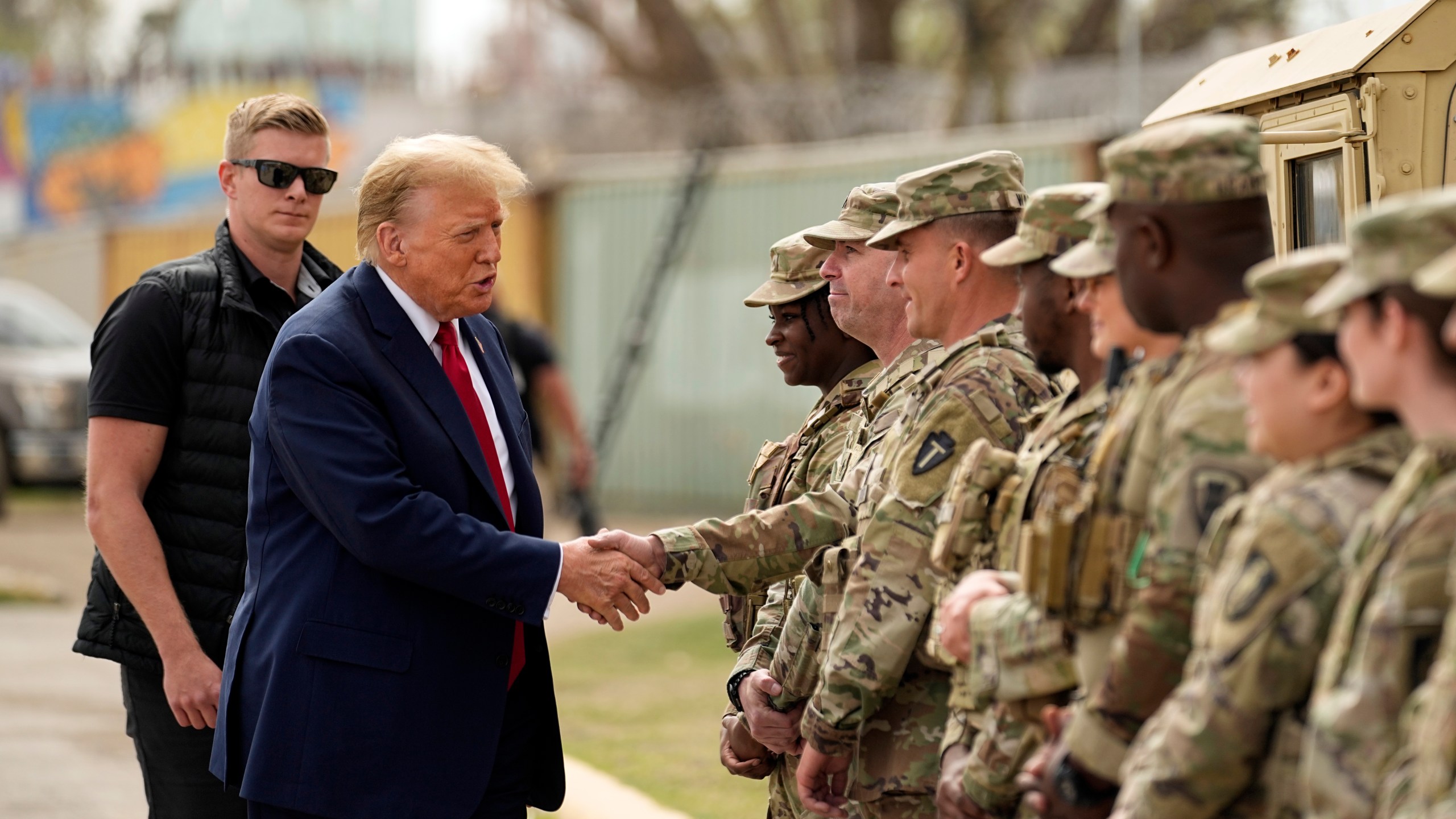 FILE - Republican presidential candidate former President Donald Trump greets members of the National Guard on the U.S.-Mexico border, Feb. 29, 2024, in Eagle Pass, Texas. (AP Photo/Eric Gay, File)