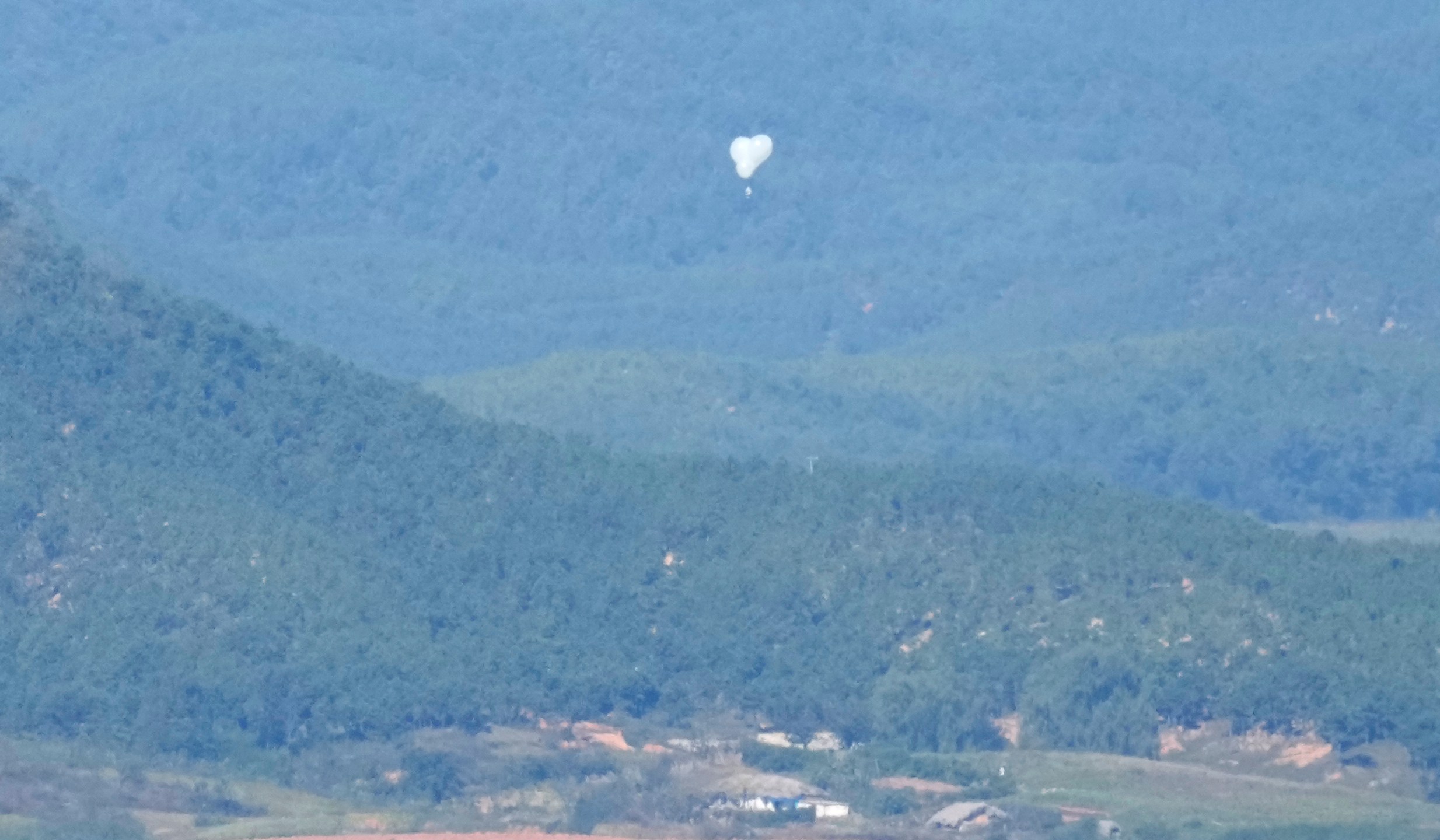 FILE - North Korean balloons are seen from the Unification Observation Post in Paju, South Korea, near the border with North Korea, Friday, Oct. 4, 2024. (AP Photo/Lee Jin-man, File)