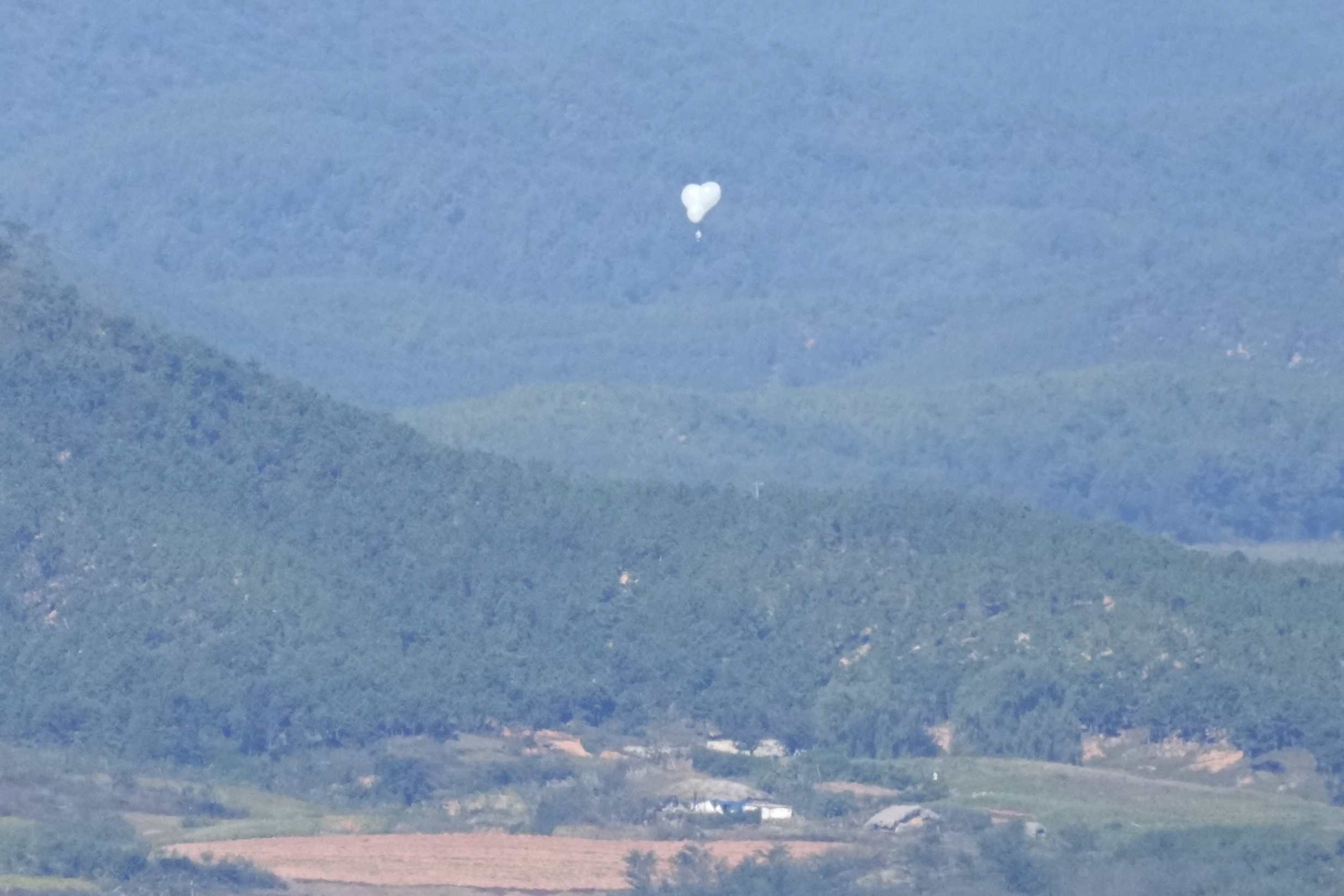 FILE - North Korean balloons are seen from the Unification Observation Post in Paju, South Korea, near the border with North Korea, Friday, Oct. 4, 2024. (AP Photo/Lee Jin-man, File)