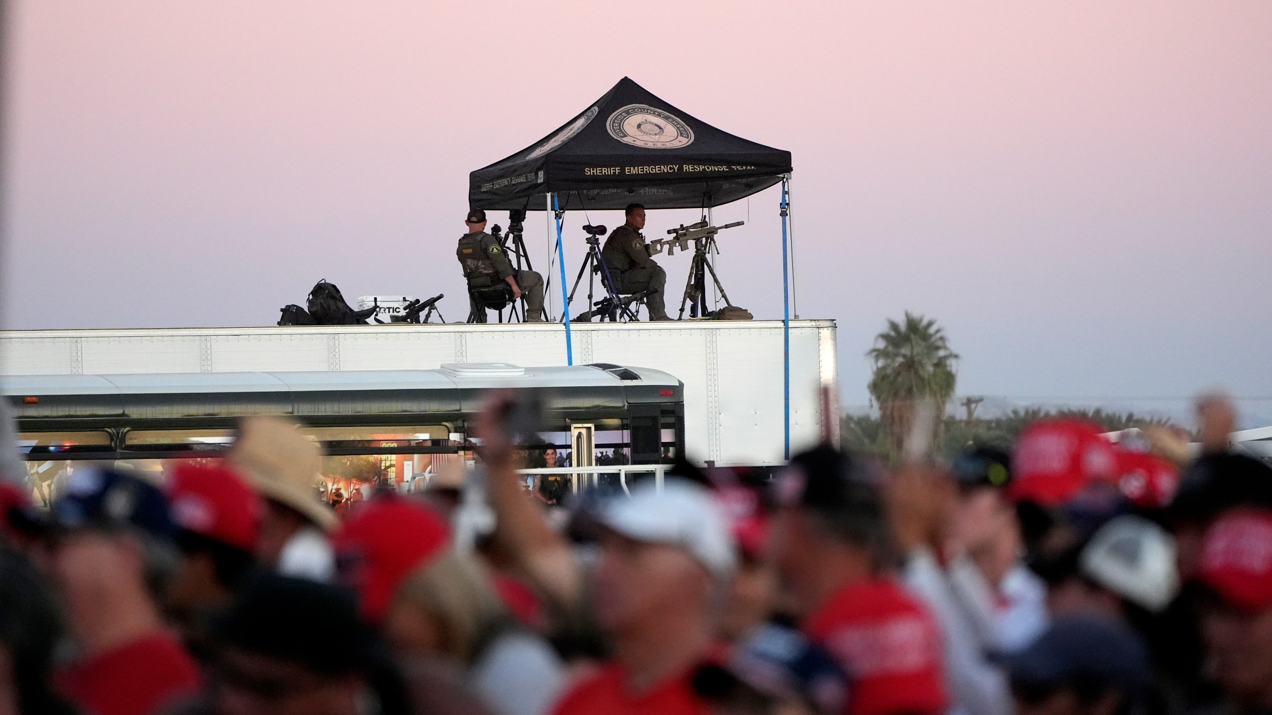 Law enforcement snipers look over the scene as Republican presidential nominee former President Donald Trump speaks at a campaign rally at the Calhoun Ranch, Saturday, Oct. 12, 2024, in Coachella, Calif. (AP Photo/Alex Brandon)