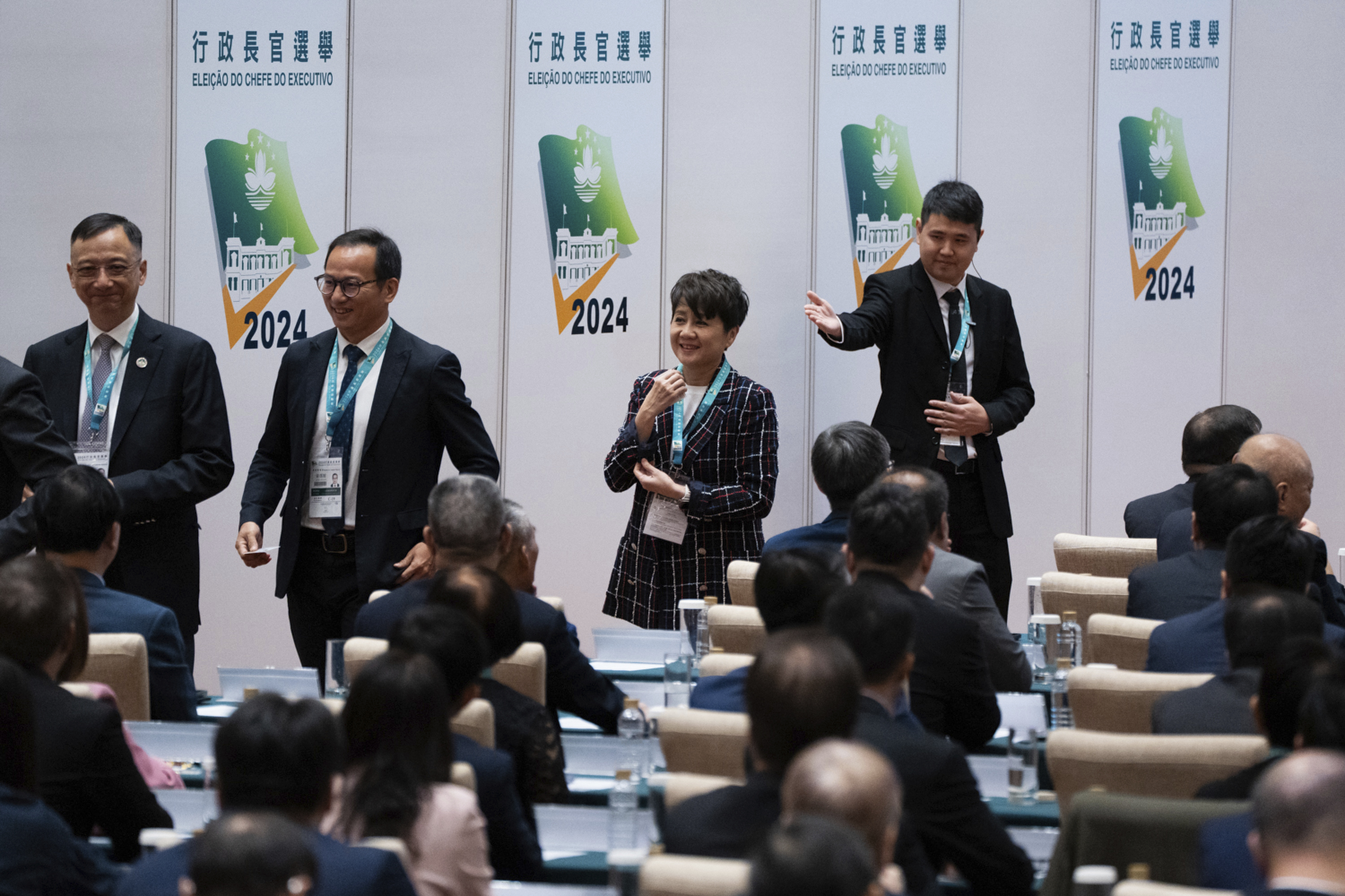 Lawmaker Angela Leong, center, one of late casino tycoon Stanley Ho's widows, queues to vote during the chief executive election in Macao, Sunday, Oct. 13, 2024. (AP Photo/Bertha Wang)