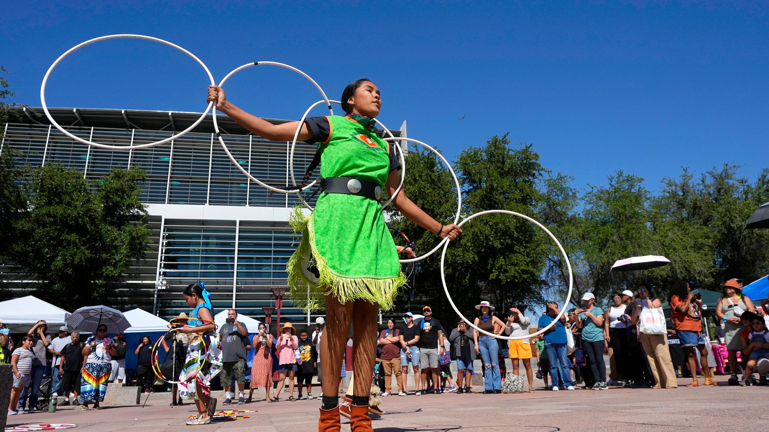 FILE - Performers from the Native American Hoop Dance of Ballet Arizona dance at an Indigenous Peoples Day festival, Oct. 9, 2023, in Phoenix. (AP Photo/Ross D. Franklin, File)