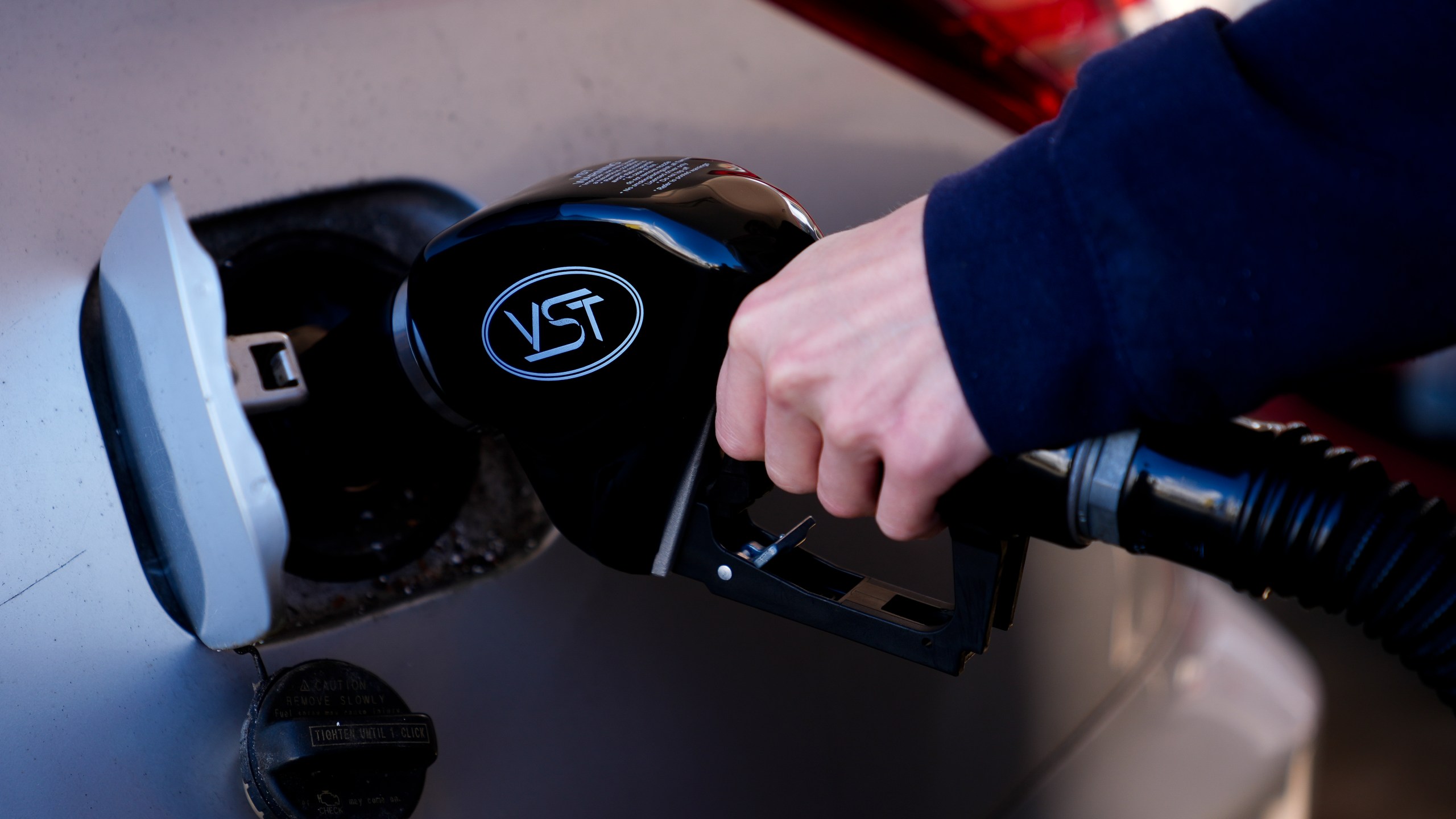 A driver fills up at a gasoline pump at a Shell gas station, Wednesday, Oct. 9, 2024, in Seattle. (AP Photo/Lindsey Wasson)