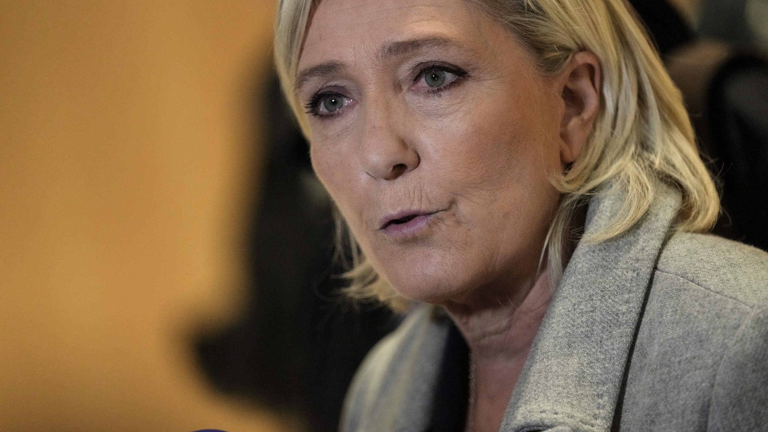 French far-right leader Marine Le Pen speaks to the media as she arrives at the court house in Paris, Monday, Sept. 30, 2024. (AP Photo/Thibault Camus)