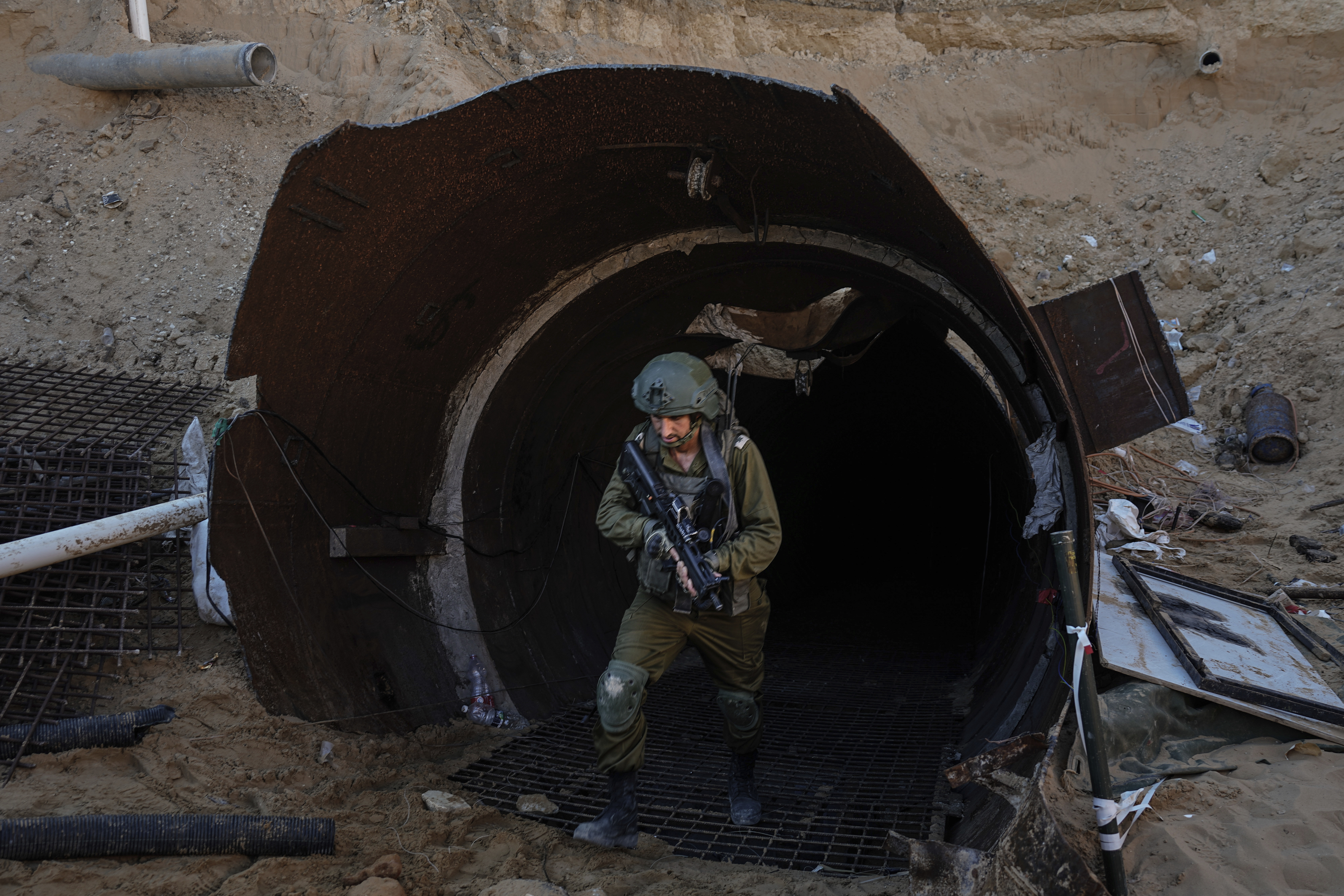 FILE - Israeli soldiers exit a tunnel that the military says Hamas militants used to attack the Erez crossing in the northern Gaza Strip, Friday, Dec. 15, 2023. (AP Photo/Ariel Schalit, File)