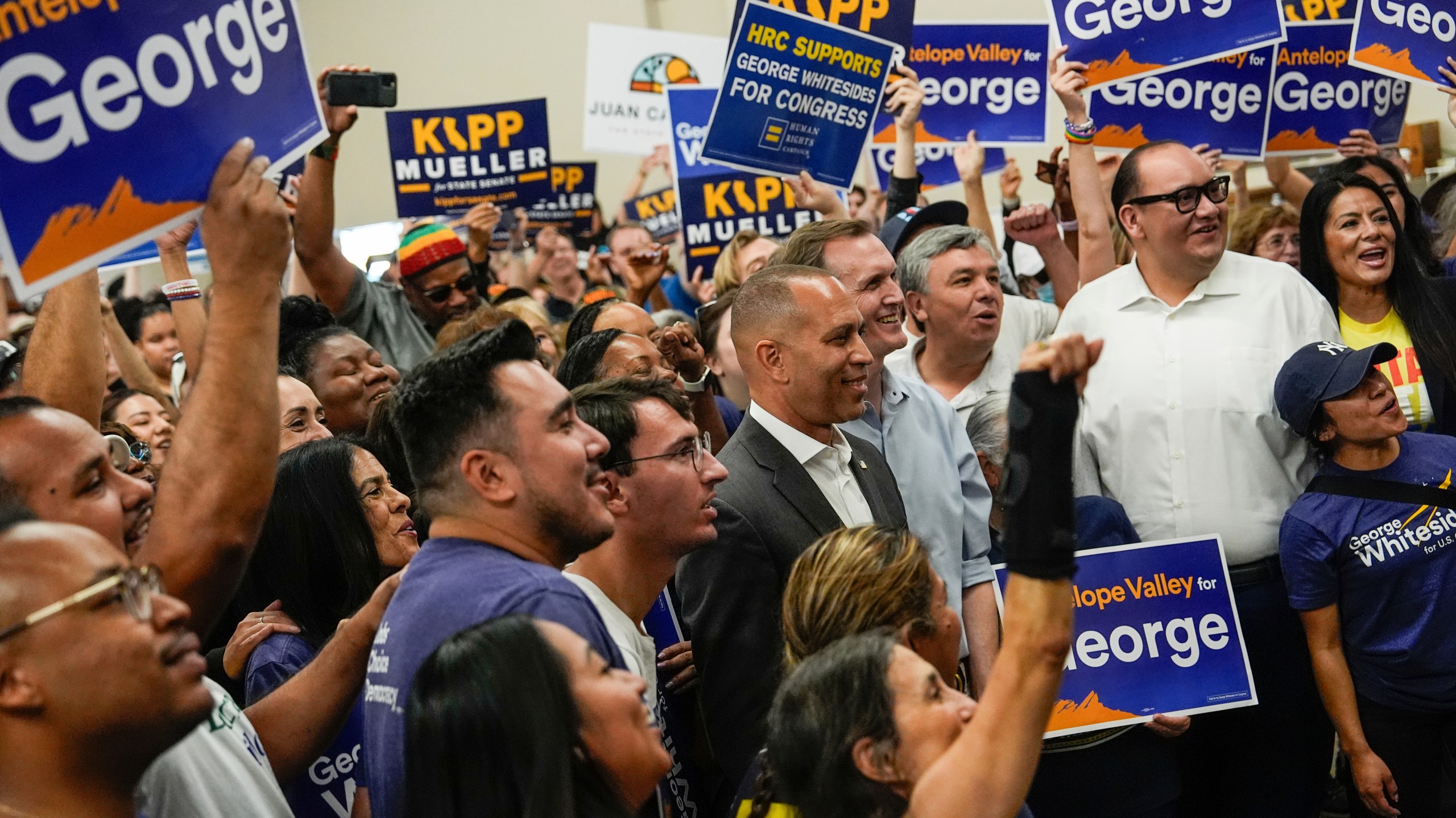 House Minority Leader Hakeem Jeffries, D-N.Y., takes a photo with a volunteers at a canvass launch for George Whitesides, Sunday, Oct. 13, 2024, in Palmdale, Calif. (AP Photo/Julia Demaree Nikhinson)