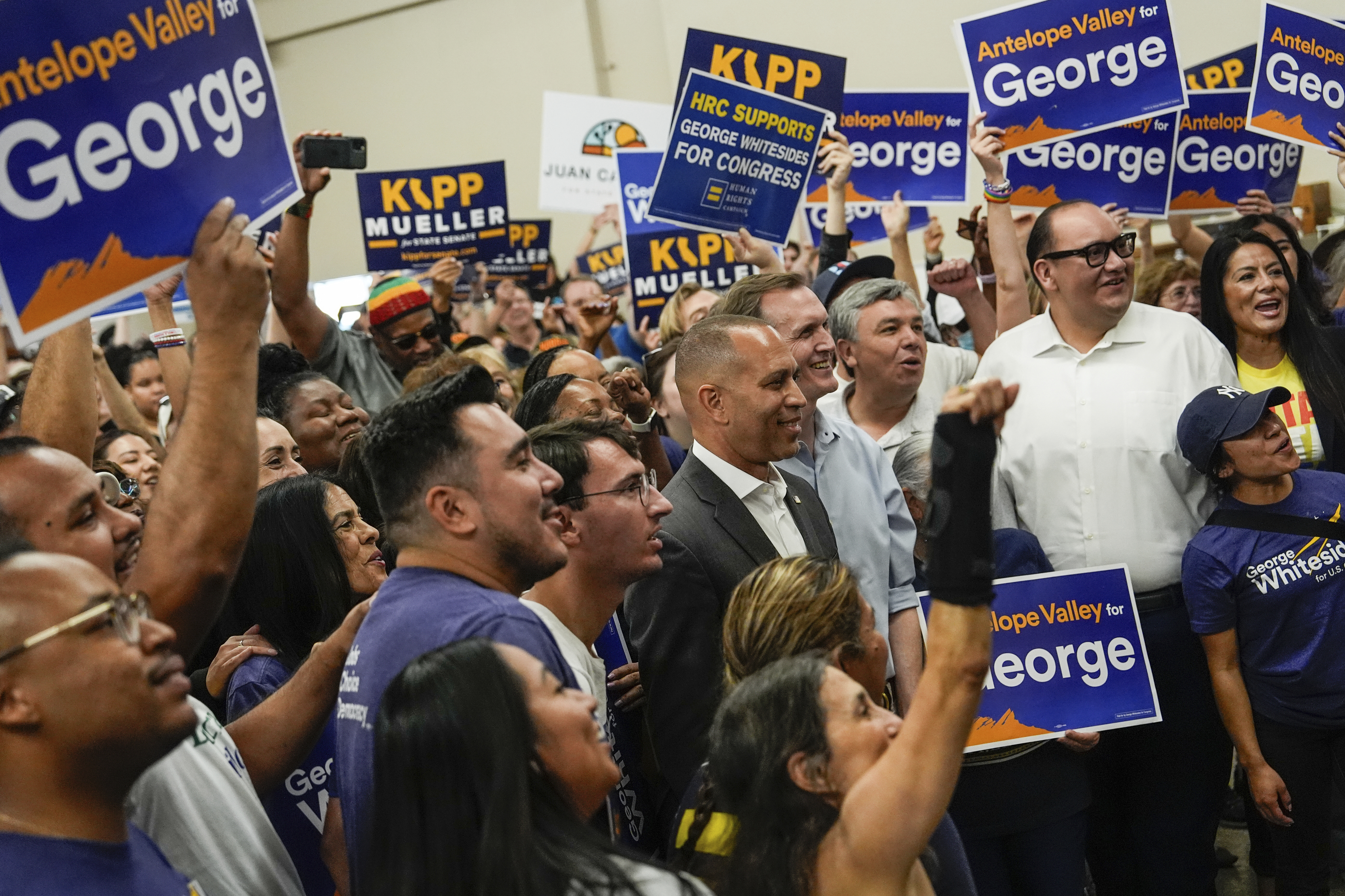 House Minority Leader Hakeem Jeffries, D-N.Y., takes a photo with a volunteers at a canvass launch for George Whitesides, Sunday, Oct. 13, 2024, in Palmdale, Calif. (AP Photo/Julia Demaree Nikhinson)