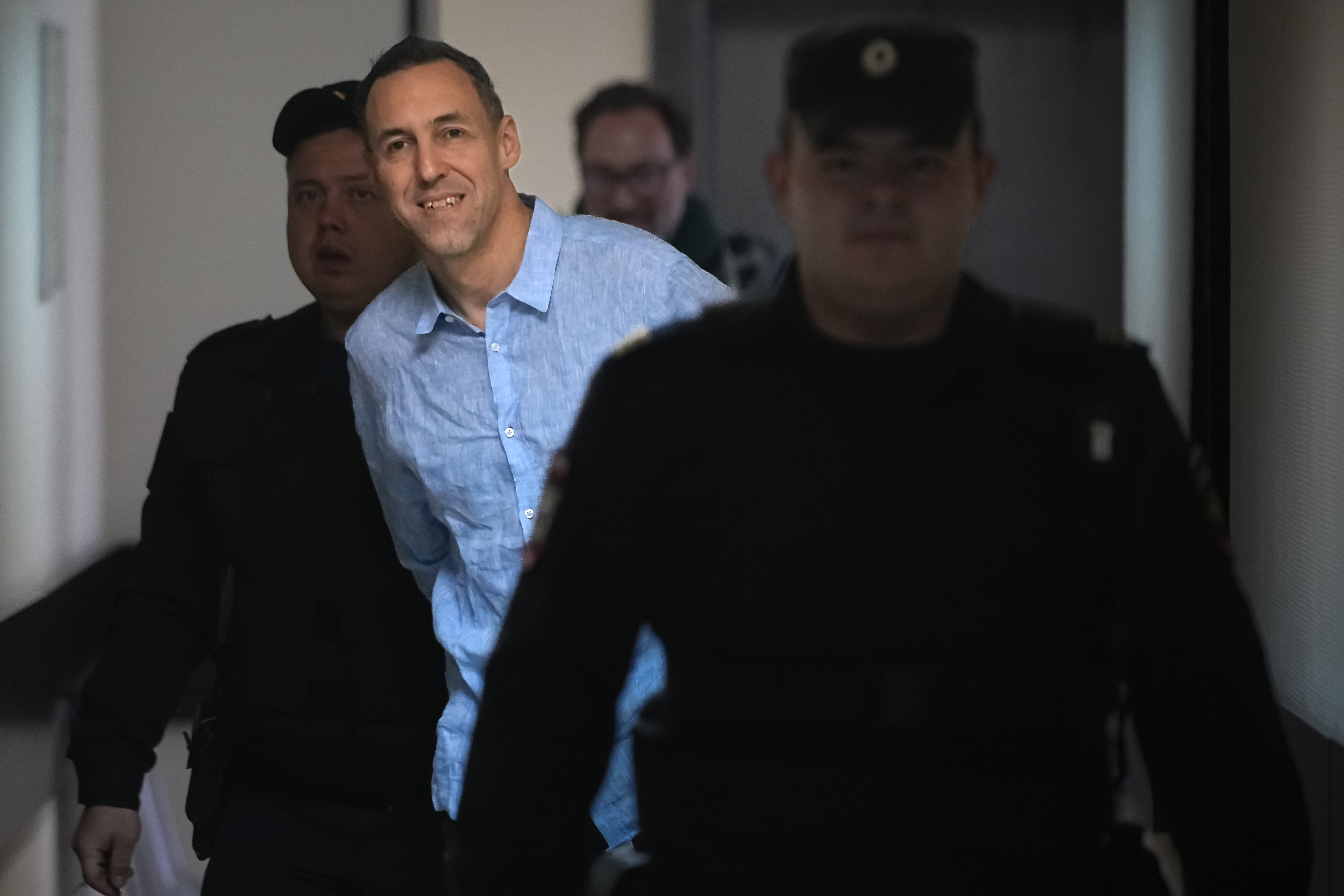 French citizen Laurent Vinatier is escorted to a courtroom at the Zamoskvoretsky District Court in Moscow, Russia, on Monday, Oct. 14, 2024. (AP Photo/Pavel Bednyakov)