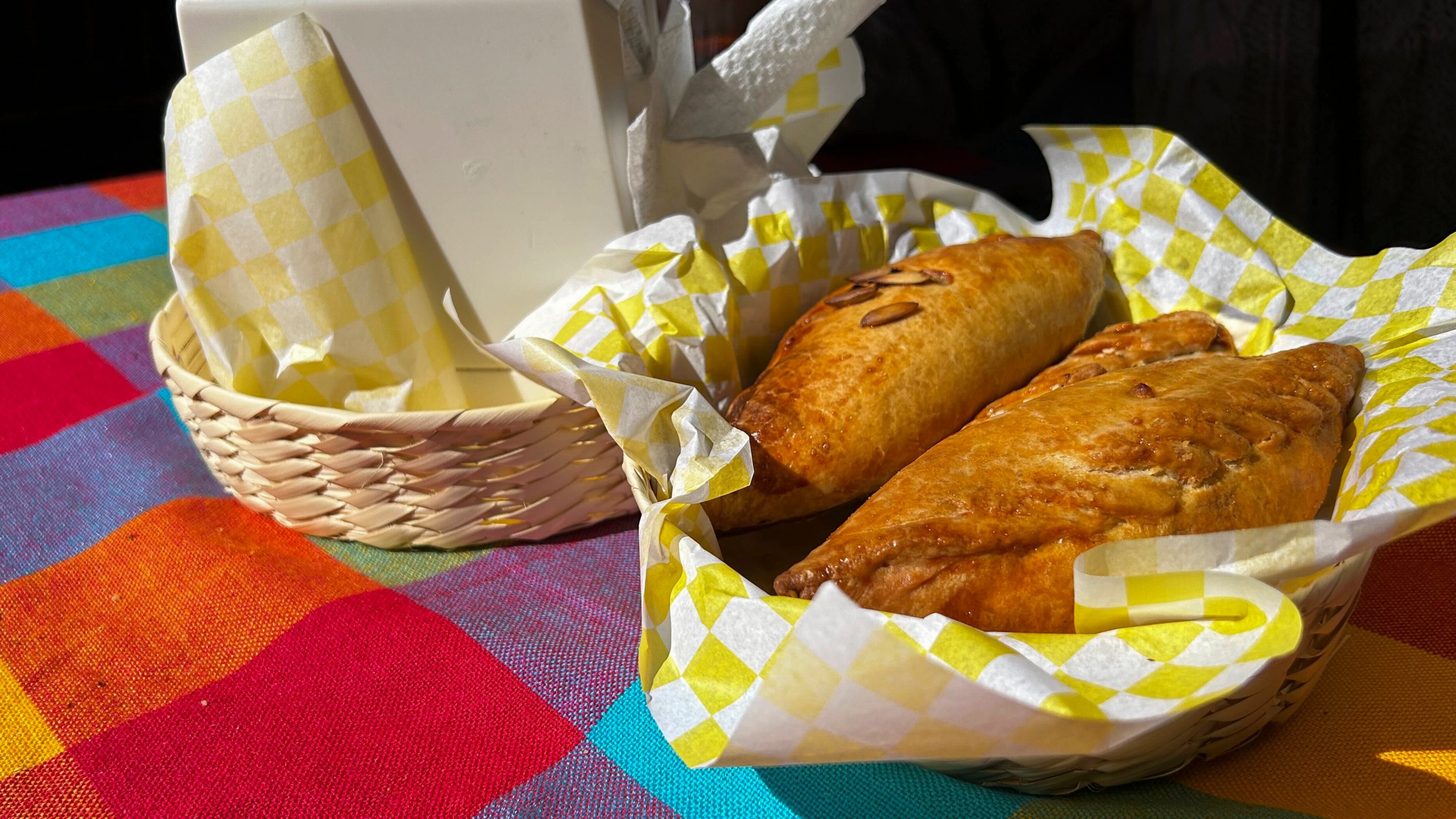 A basket of Mexican pastes sit on a patron's table before they are eated for lunch at the 16th International Paste Festival in Mineral del Monte, Mexico, Saturday, Oct. 12, 2024. (AP Photo/India Grant)