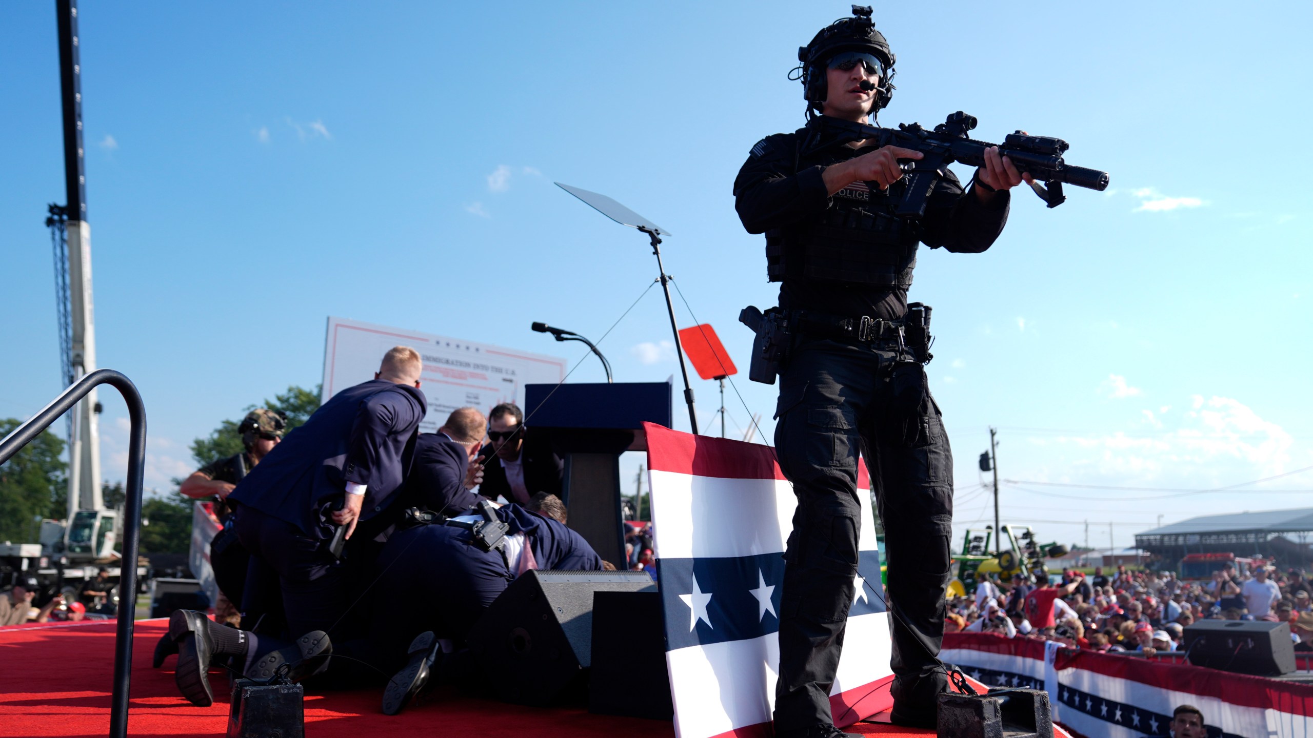 FILE - Republican presidential candidate former President Donald Trump is covered by U.S. Secret Service agents at a campaign rally, July 13, 2024, in Butler, Pa. (AP Photo/Evan Vucci, File)