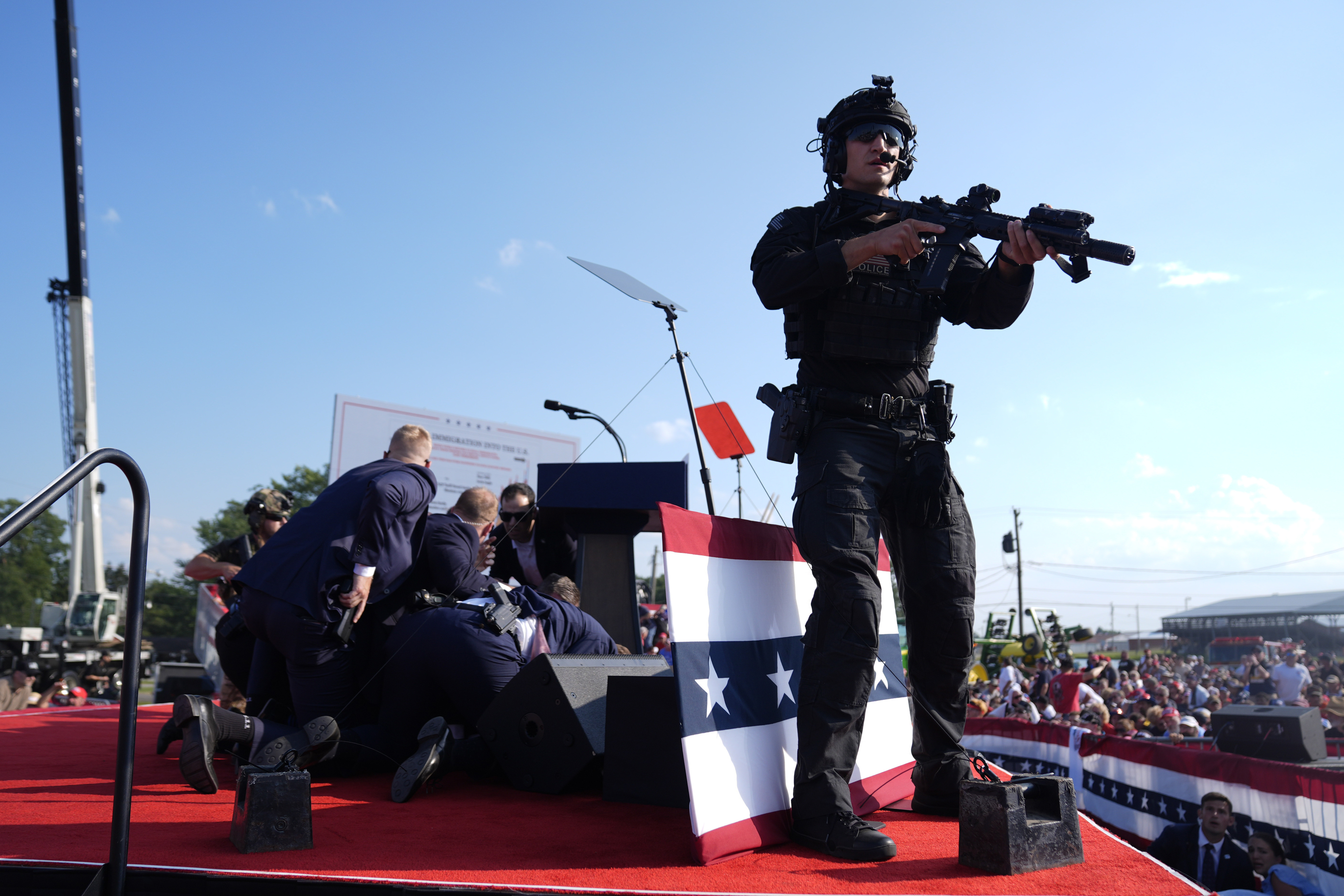 FILE - Republican presidential candidate former President Donald Trump is covered by U.S. Secret Service agents at a campaign rally, July 13, 2024, in Butler, Pa. (AP Photo/Evan Vucci, File)