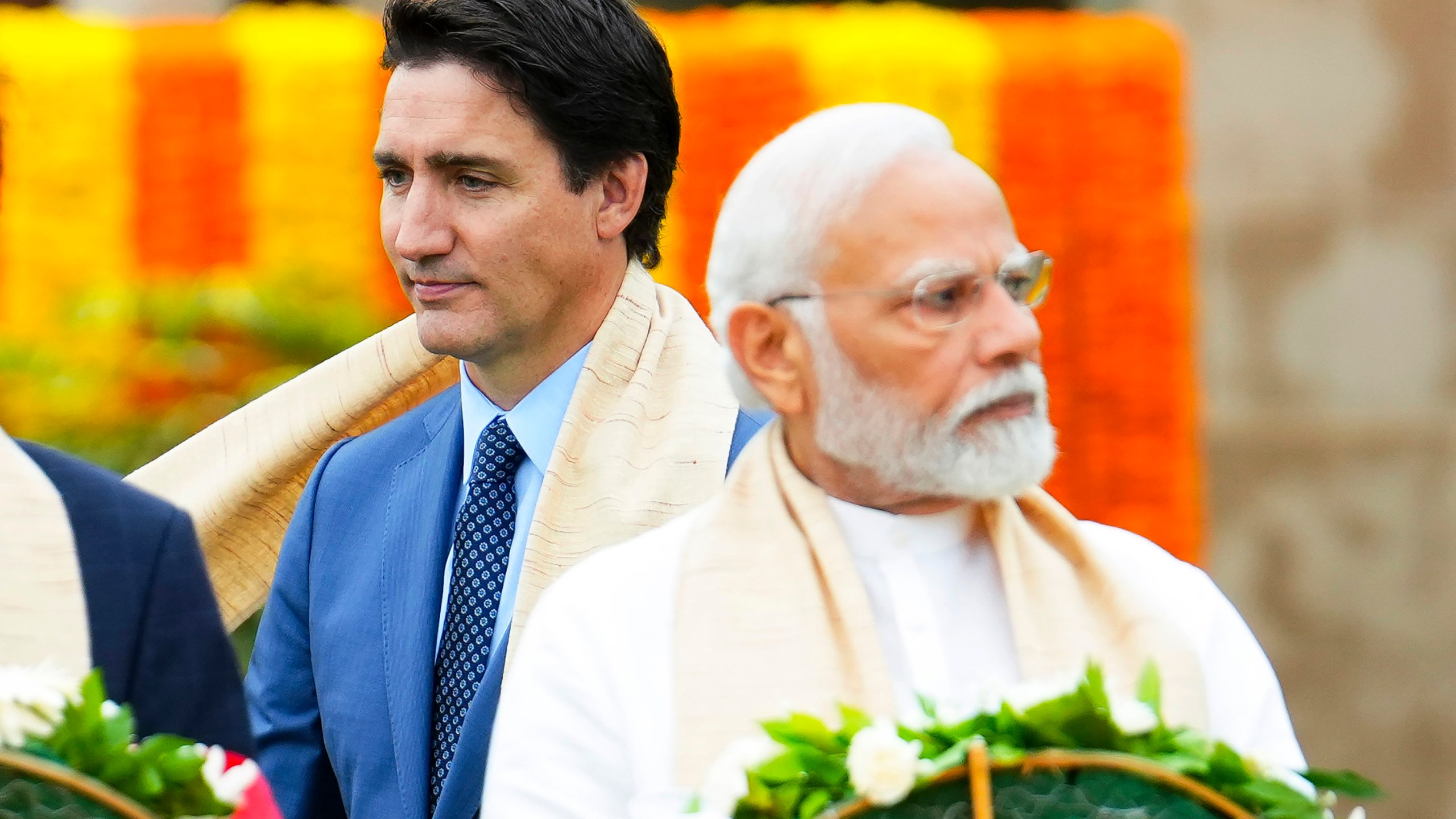 FILE - Canada's Prime Minister Justin Trudeau, left, walks past India's Prime Minister Narendra Modi as they take part in a wreath-laying ceremony at Raj Ghat, Mahatma Gandhi's cremation site, during the G20 Summit in New Delhi, Sept. 10, 2023. (Sean Kilpatrick/The Canadian Press via AP, File)