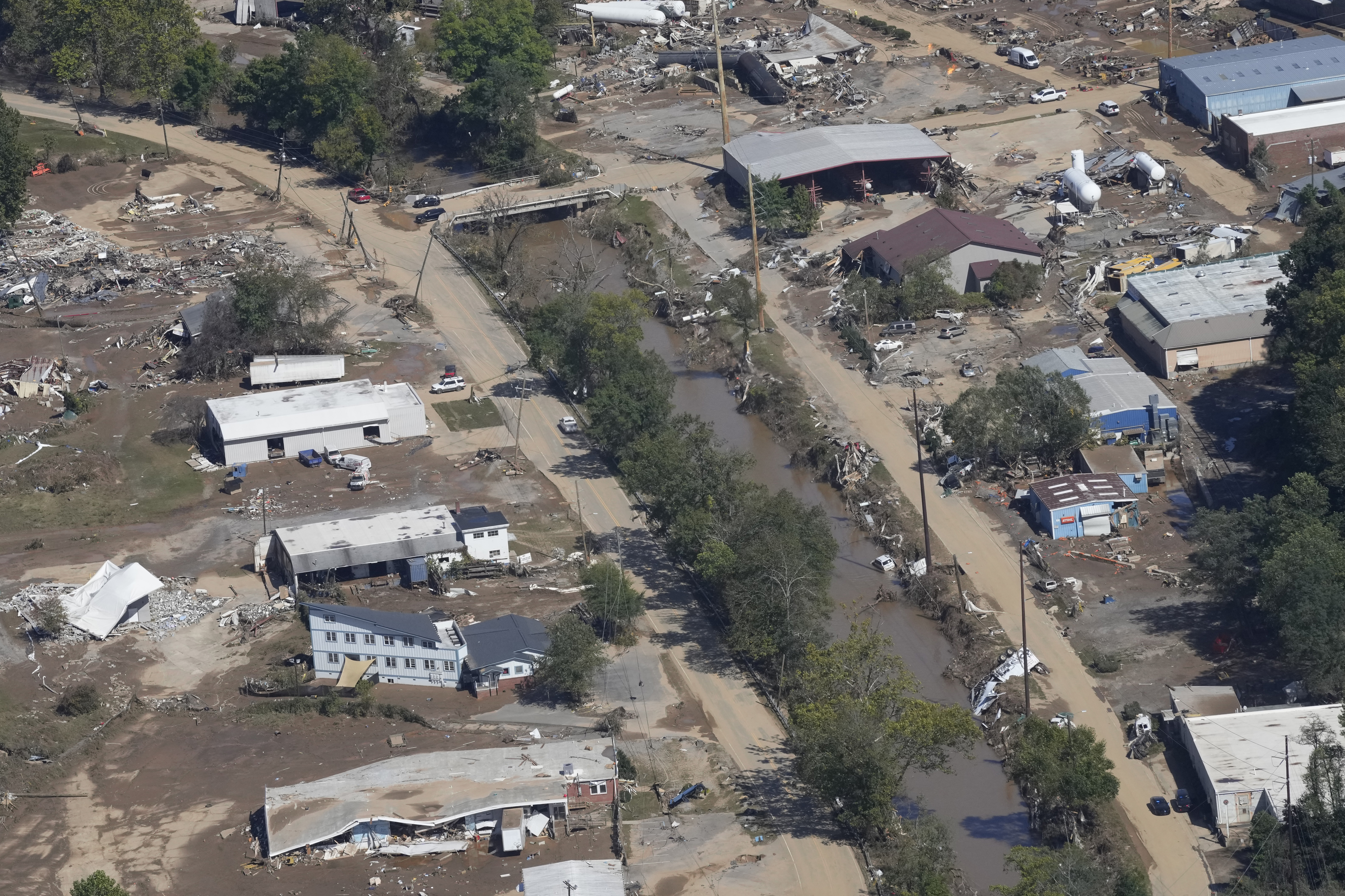 FILE - A view of damage in Asheville, N.C., is seen during an aerial tour with President Joe Biden who looked at areas impacted by Hurricane Helene near Asheville, N.C., Wednesday, Oct. 2, 2024. (AP Photo/Susan Walsh, File)