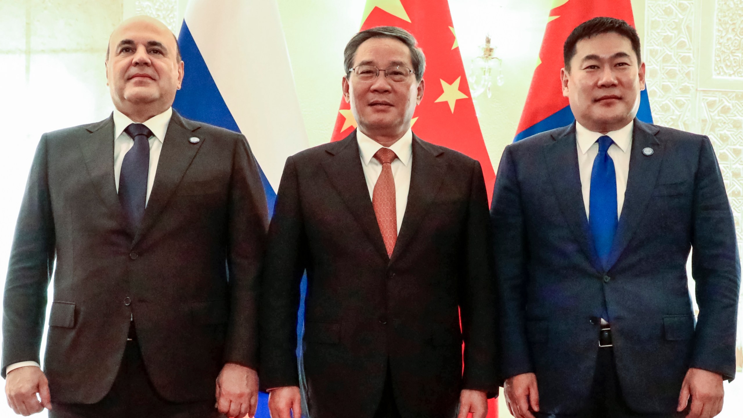 Russian Prime Minister Mikhail Mishustin, left, Chinese Premier Li Qiang, center, and Mongolian Prime Minister Luvsannamsrain Oyun-Erdene pose for a photo on the sidelines of the Shanghai Cooperation Organization (SCO) Council of Heads of Governments Summit in Islamabad, Pakistan, Wednesday, Oct. 16, 2024. (Roman Naumov, Sputnik, Government Pool Photo via AP)