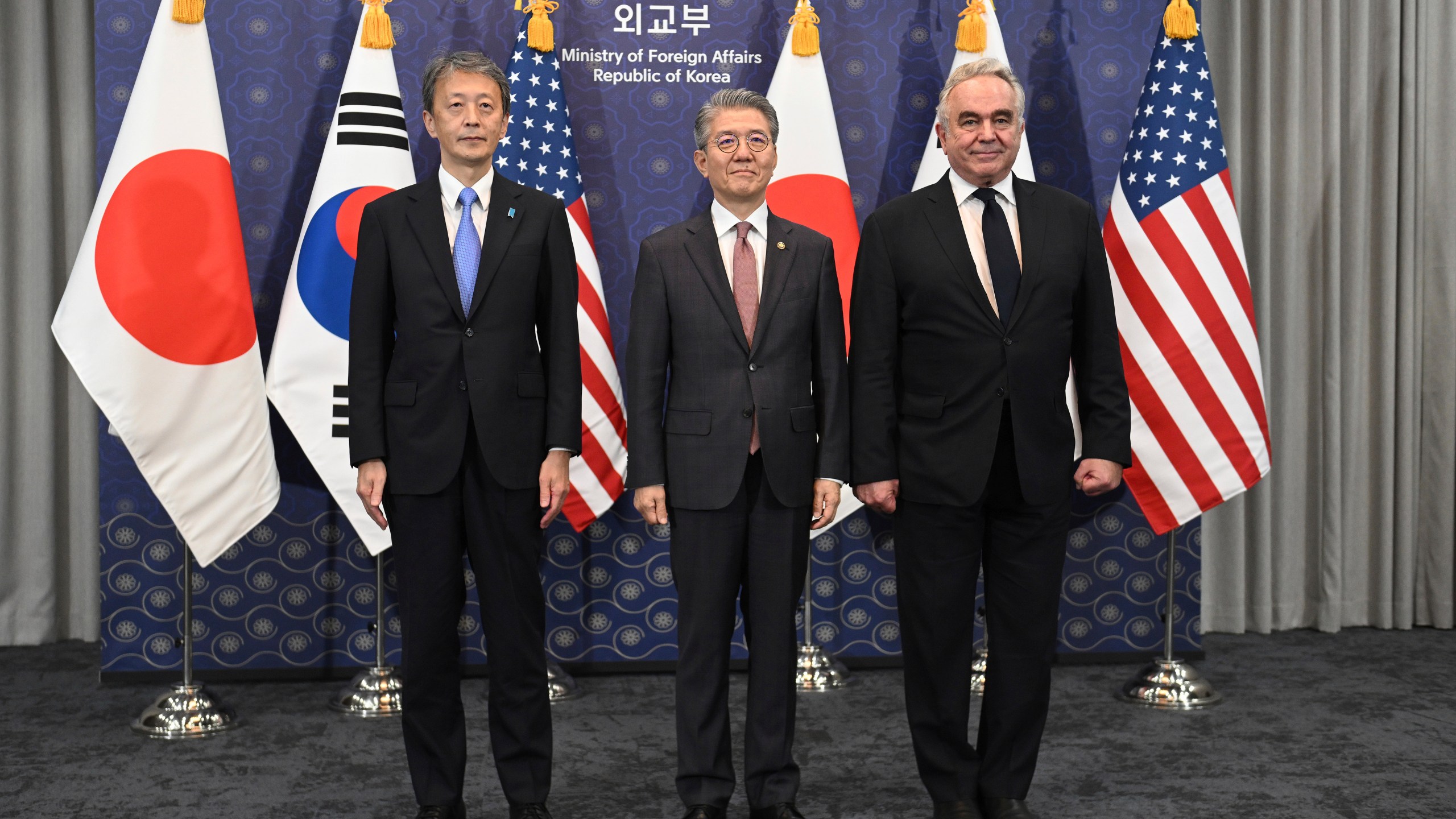 South Korea's First Vice Foreign Minister Kim Hong-kyun, center, poses for photos with United States Deputy Secretary of State Kurt Campbell, right, and Japan's Vice Foreign Minister Masataka Okano during their trilateral meeting at the Foreign Ministry in Seoul Wednesday, Oct. 16, 2024. (Jung Yeon-je/Pool Photo via AP)