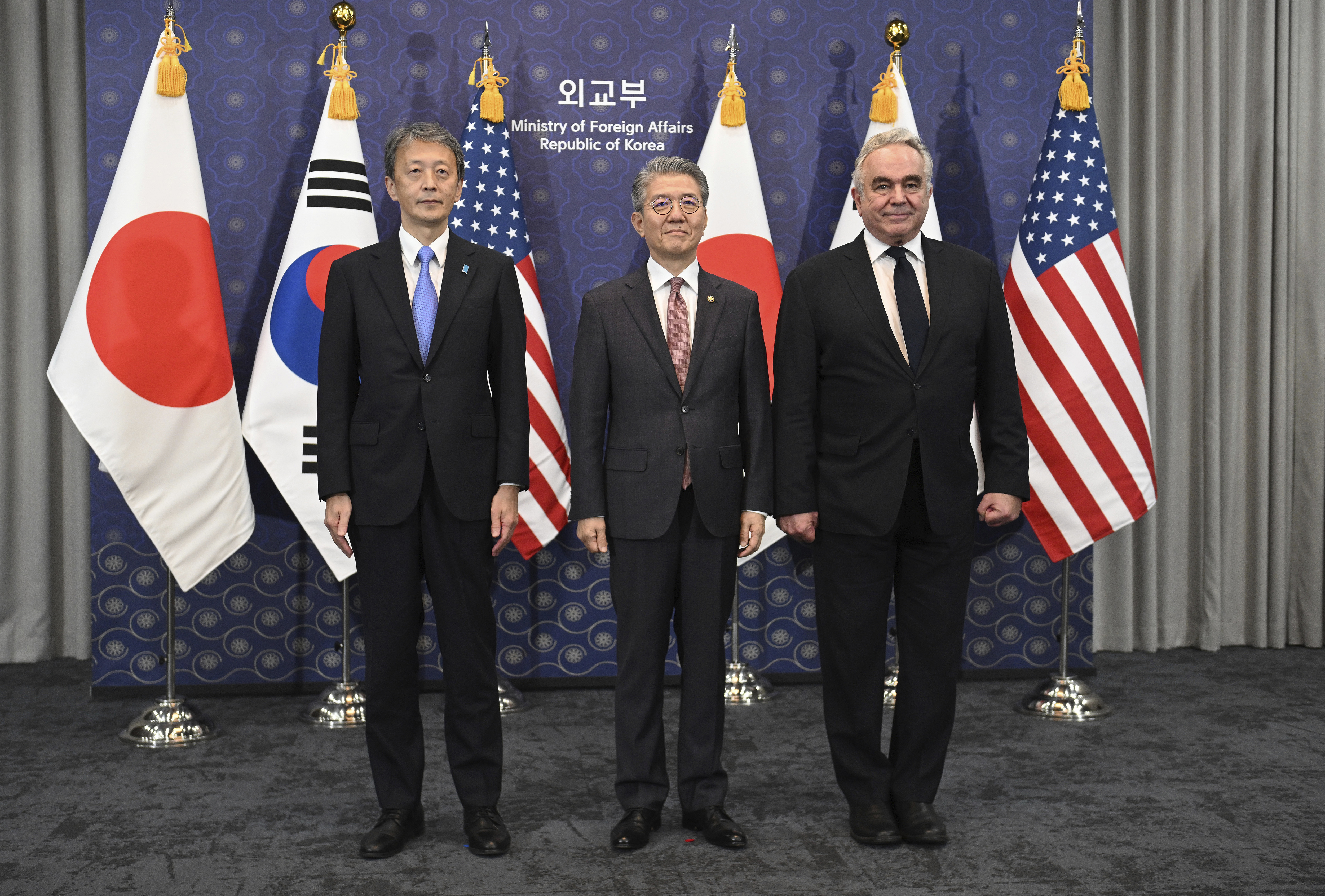 South Korea's First Vice Foreign Minister Kim Hong-kyun, center, poses for photos with United States Deputy Secretary of State Kurt Campbell, right, and Japan's Vice Foreign Minister Masataka Okano during their trilateral meeting at the Foreign Ministry in Seoul Wednesday, Oct. 16, 2024. (Jung Yeon-je/Pool Photo via AP)