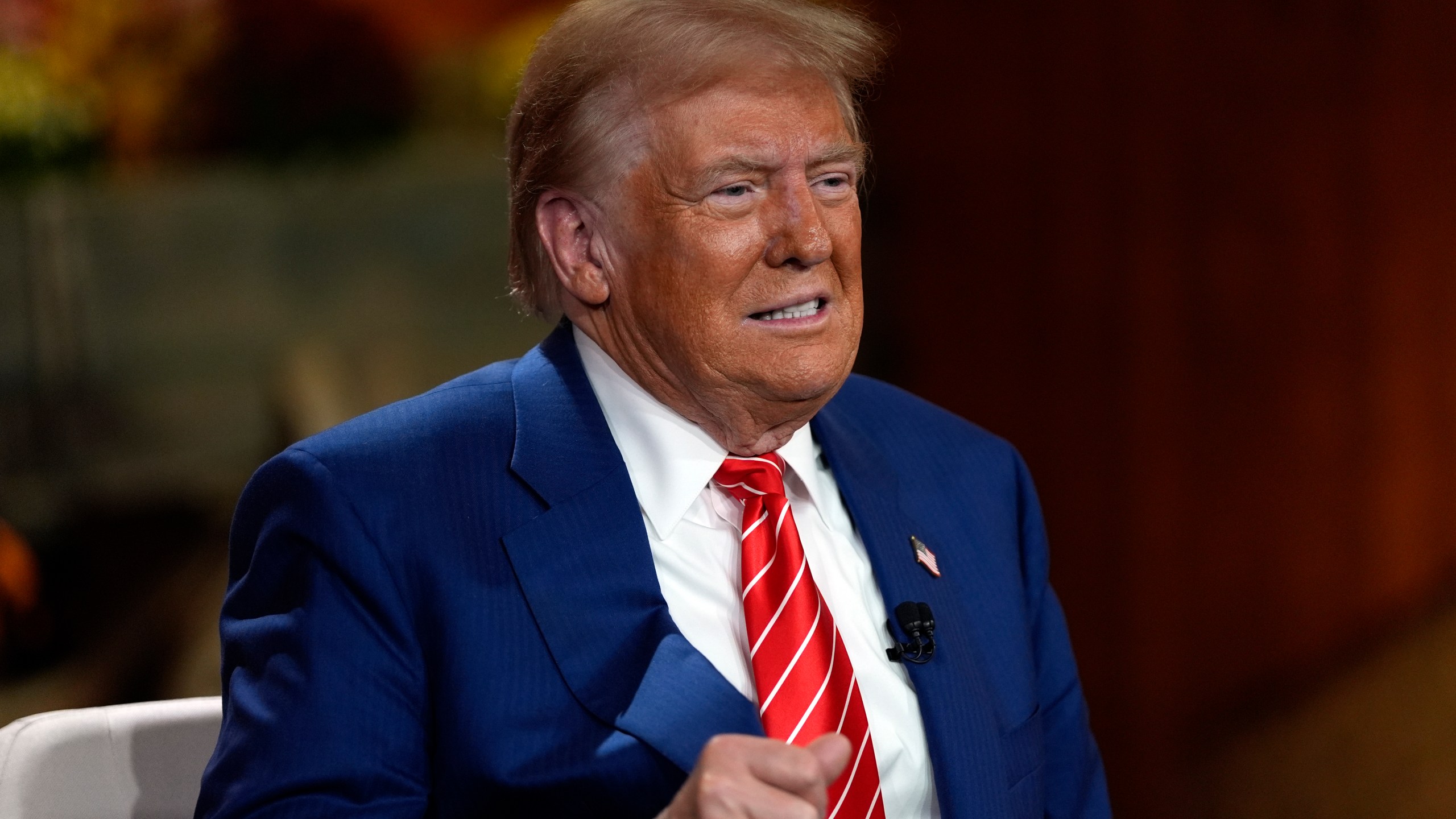 Republican presidential nominee former President Donald Trump speaks during a break in a Fox News town hall with Harris Faulkner at The Reid Barn, Tuesday, Oct. 15, 2024, in Cumming, Ga. (AP Photo/Julia Demaree Nikhinson)