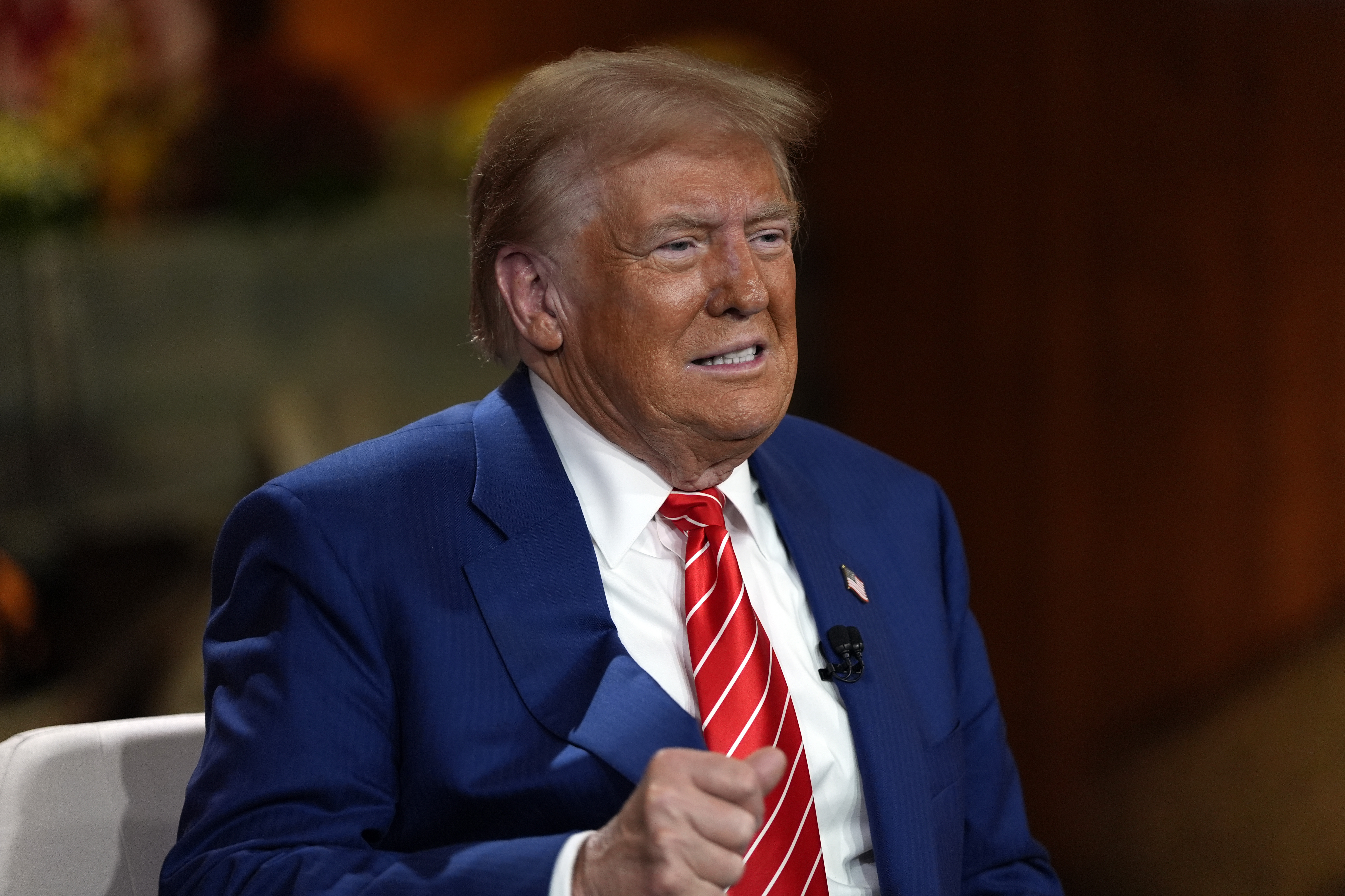 Republican presidential nominee former President Donald Trump speaks during a break in a Fox News town hall with Harris Faulkner at The Reid Barn, Tuesday, Oct. 15, 2024, in Cumming, Ga. (AP Photo/Julia Demaree Nikhinson)