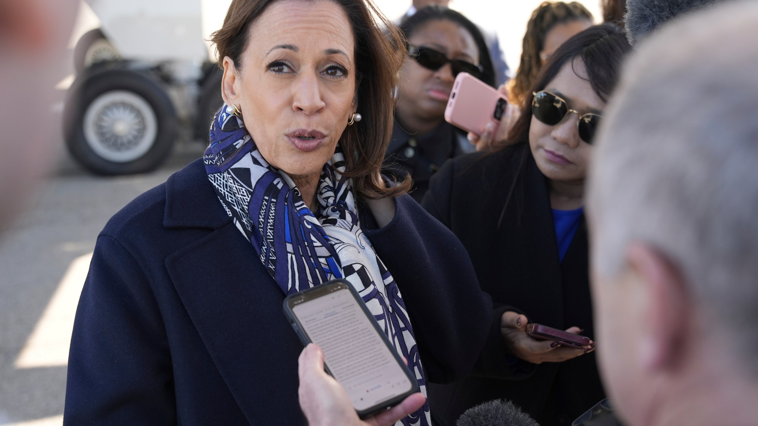 Democratic presidential nominee Vice President Kamala Harris speaks to the media before boarding Air Force Two on departure from Detroit, at Detroit Metropolitan Wayne County Airport, Wednesday, Oct. 16, 2024. (AP Photo/Jacquelyn Martin)