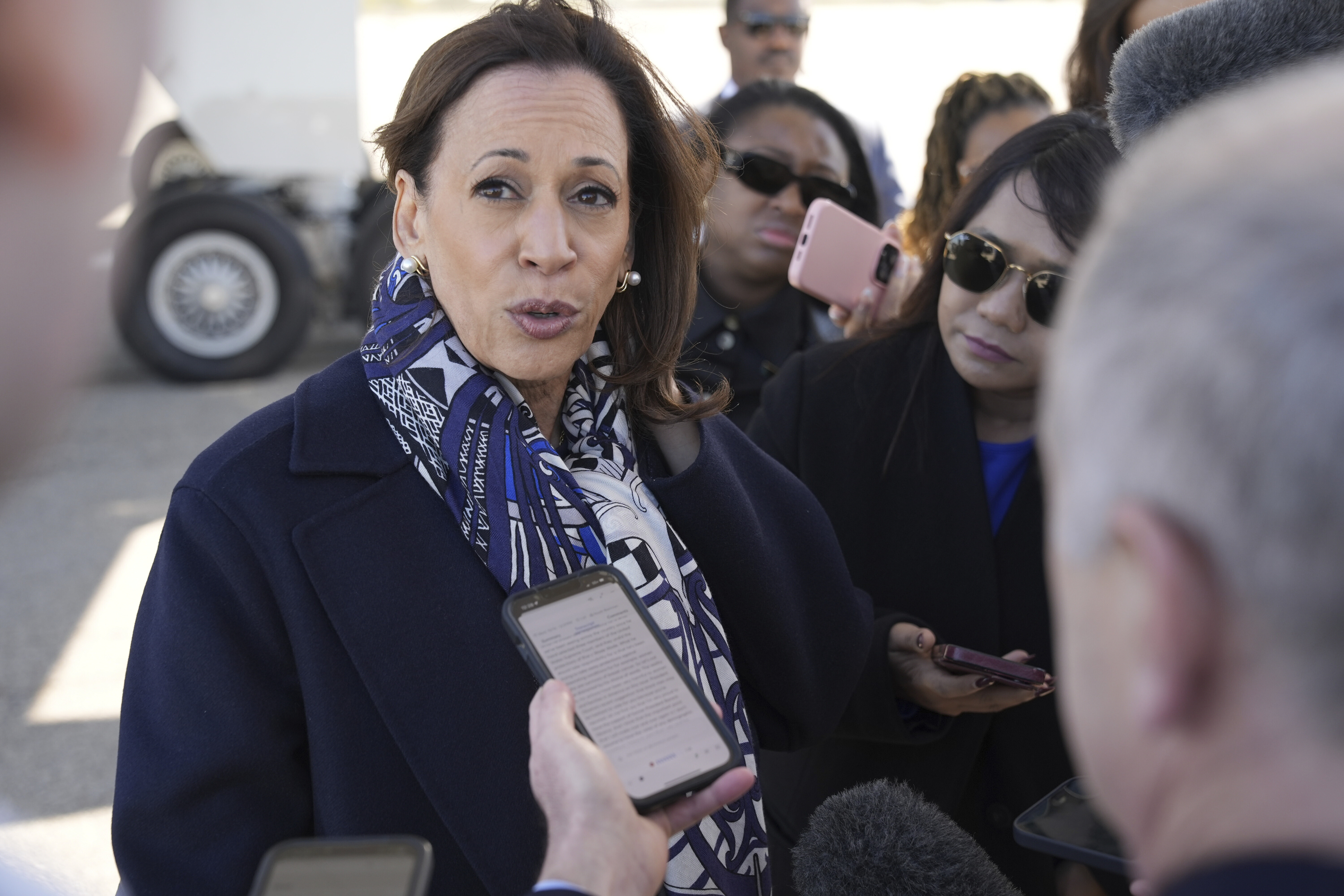 Democratic presidential nominee Vice President Kamala Harris speaks to the media before boarding Air Force Two on departure from Detroit, at Detroit Metropolitan Wayne County Airport, Wednesday, Oct. 16, 2024. (AP Photo/Jacquelyn Martin)