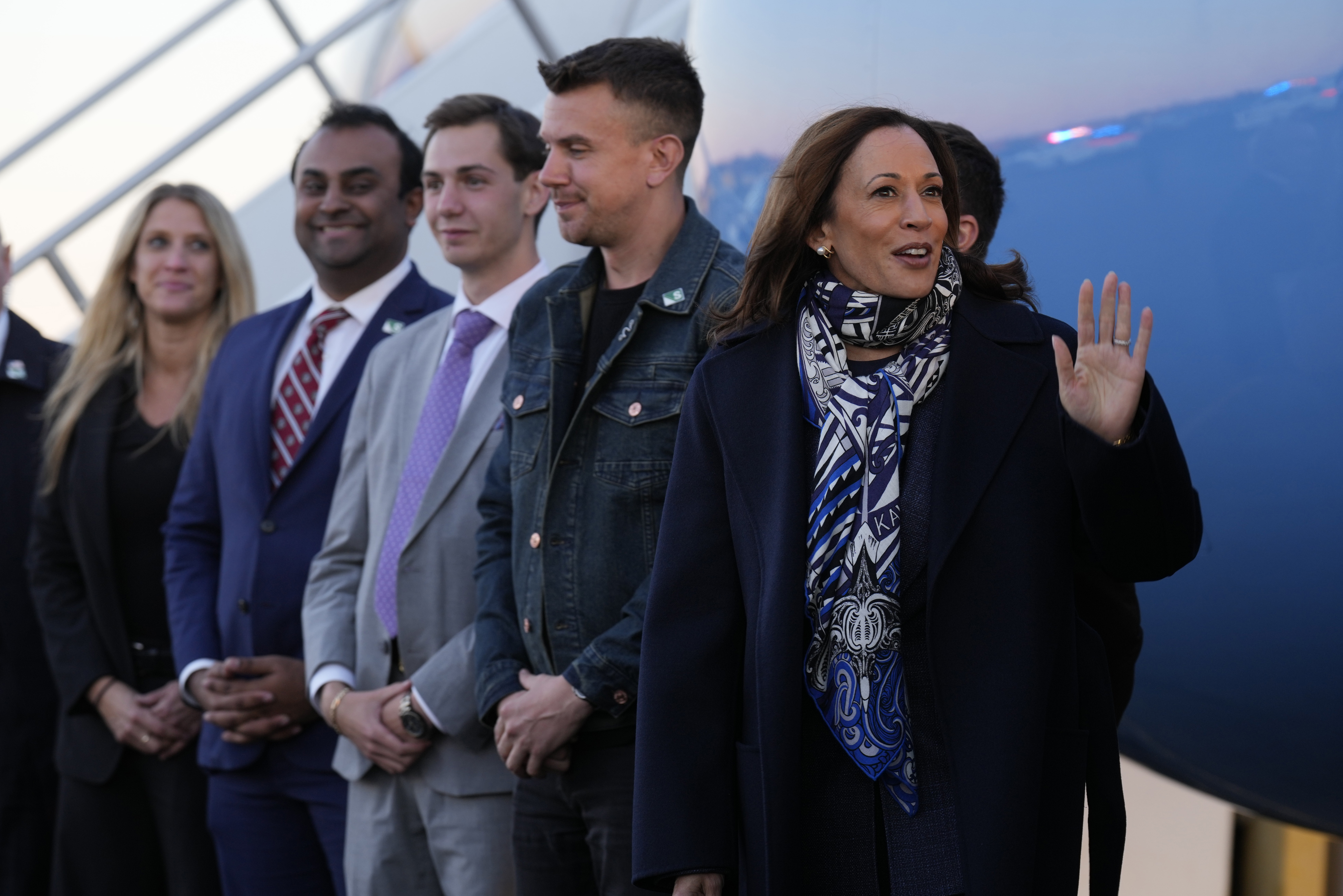 Democratic presidential nominee Vice President Kamala Harris waves at Trenton-Mercer Airport, in Mercer County, N.J., before departing en route to Milwaukee, Wednesday, Oct. 16, 2024. (AP Photo/Jacquelyn Martin)