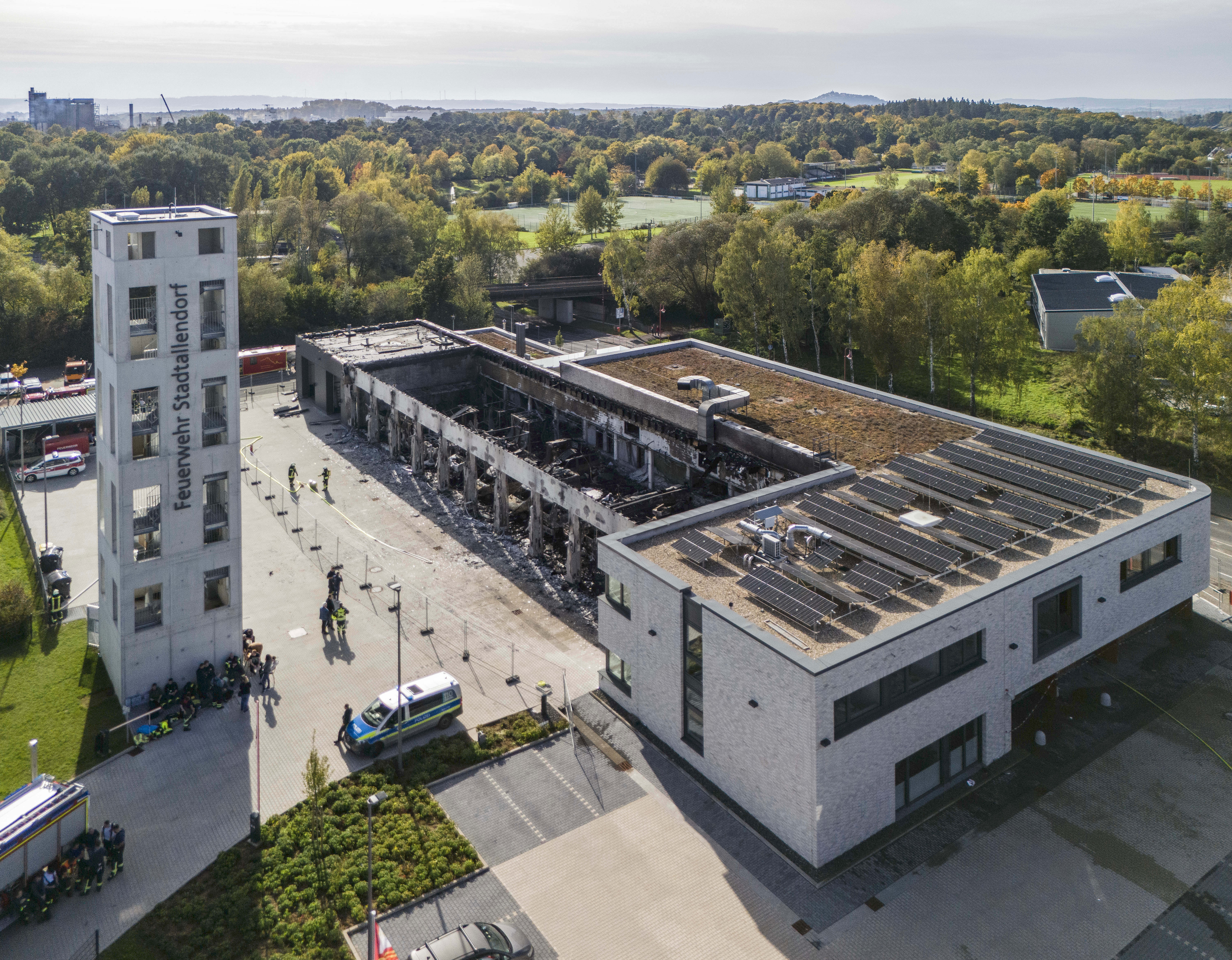 Firefighters work on the site of a fire in a vehicle depot in Stadtallendorf, Germany, Wednesday Oct. 16, 2024. (Andreas Arnold/dpa via AP)