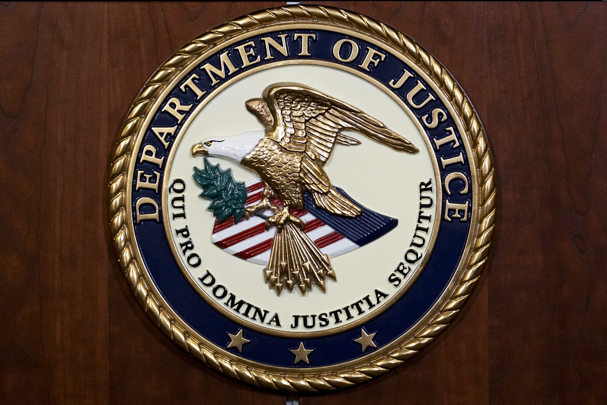 FILE - The seal of the Department of Justice, Aug. 1, 2023, at the Department of Justice in Washington. (AP Photo/J. Scott Applewhite, File)