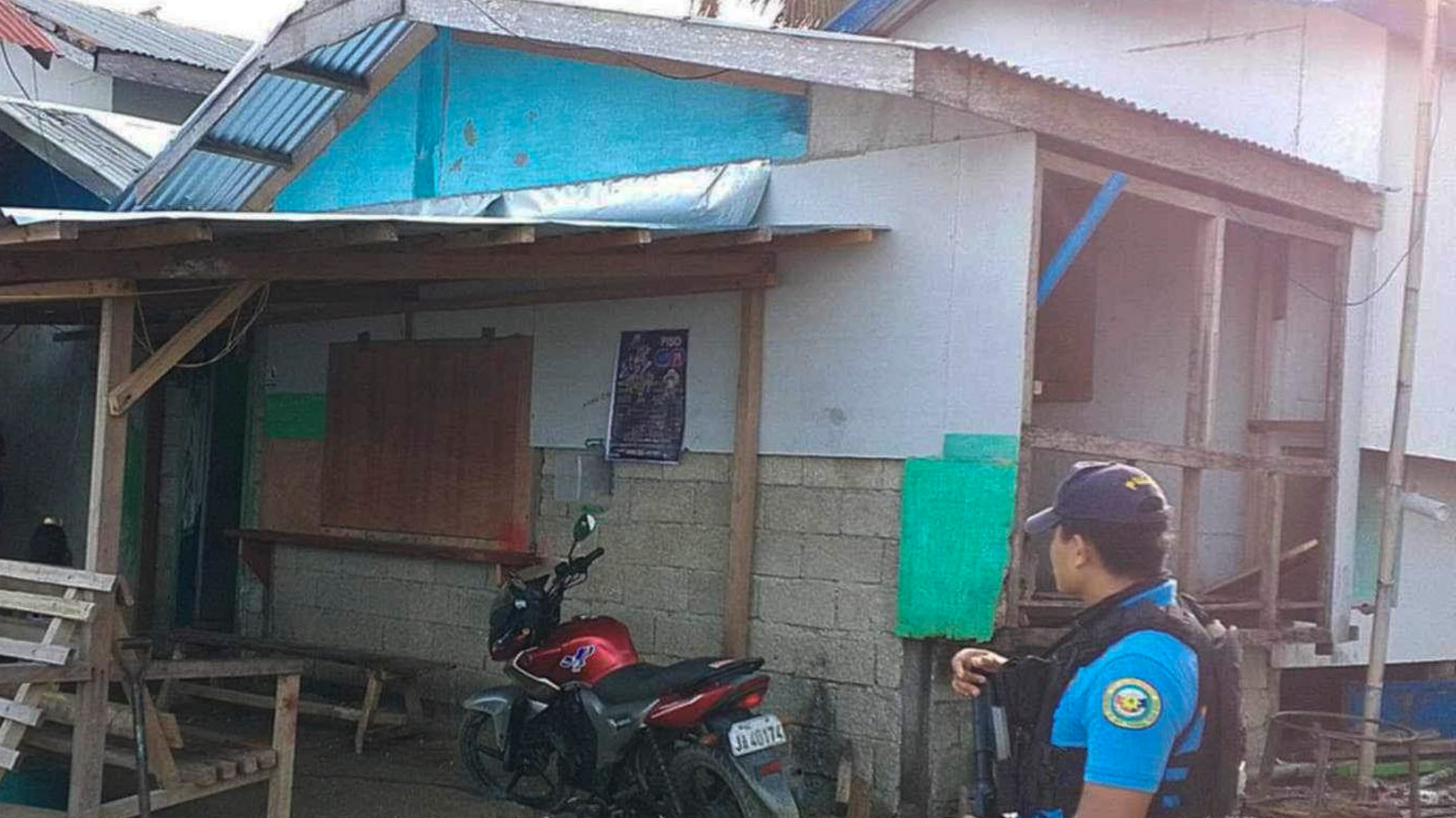 In this photo provided by the Philippine National Police Regional Office 9, a policeman checks an area Friday Oct. 18, 2024, where an American identified as Elliot Onil Eastman, from Vermont, was reportedly abducted by gunmen in Sibuco town, Zamboanga del Norte province, southern Philippines. (Philippine National Police Regional Office 9 via AP)