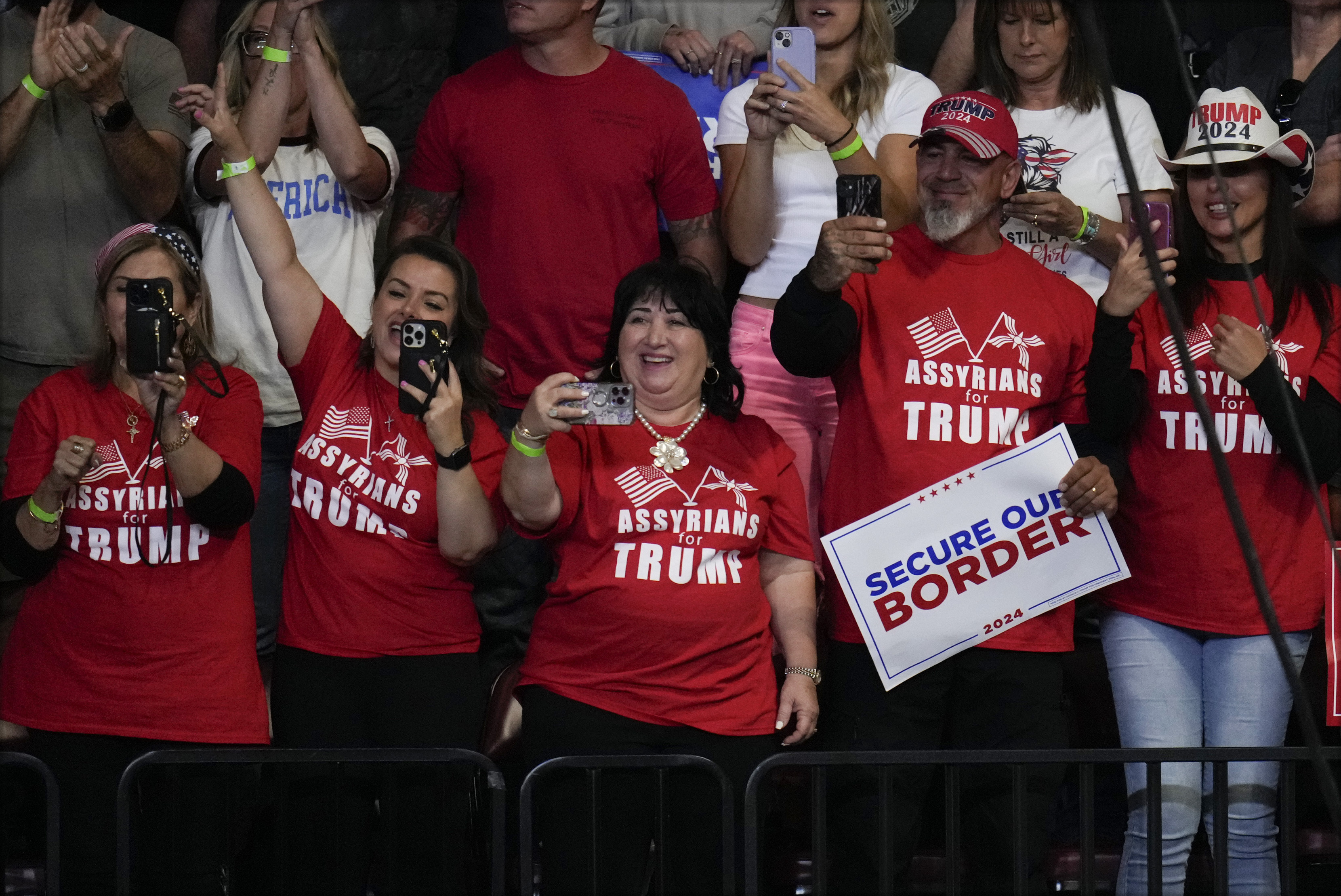 Supporters react before Republican presidential nominee former President Donald Trump speaks at a campaign rally at the Findlay Toyota Arena Sunday, Oct. 13, 2024, in Prescott Valley, Ariz. (AP Photo/Ross D. Franklin)