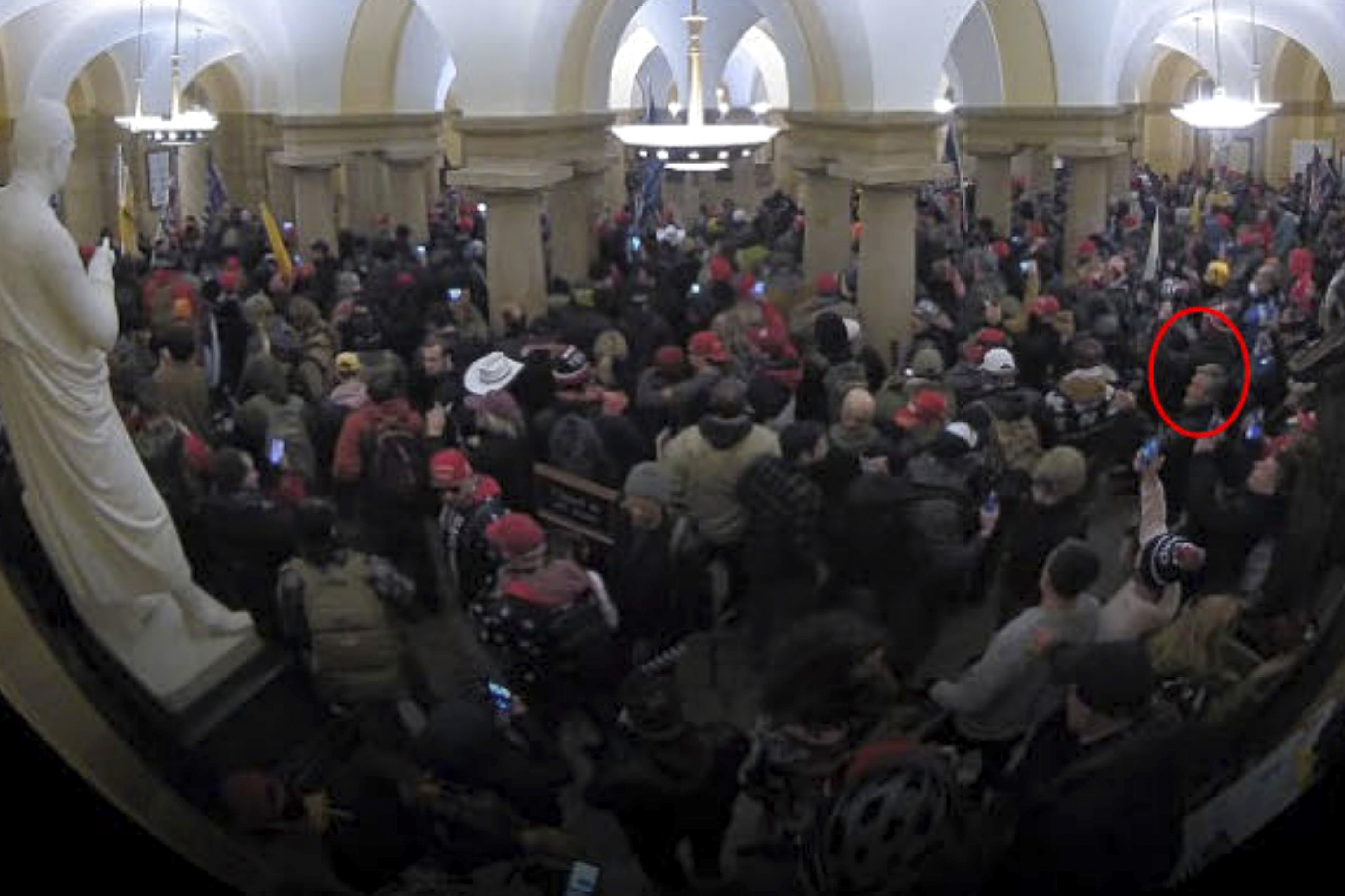 This image from security video of Michael Daniele, a retired New Jersey State Police trooper, seen in the Crypt in the U.S. Capitol on Jan. 6, 2021, was contained in the Justice Department affidavit and complaint in support of the arrest of Daniele. (Department of Justice via AP)