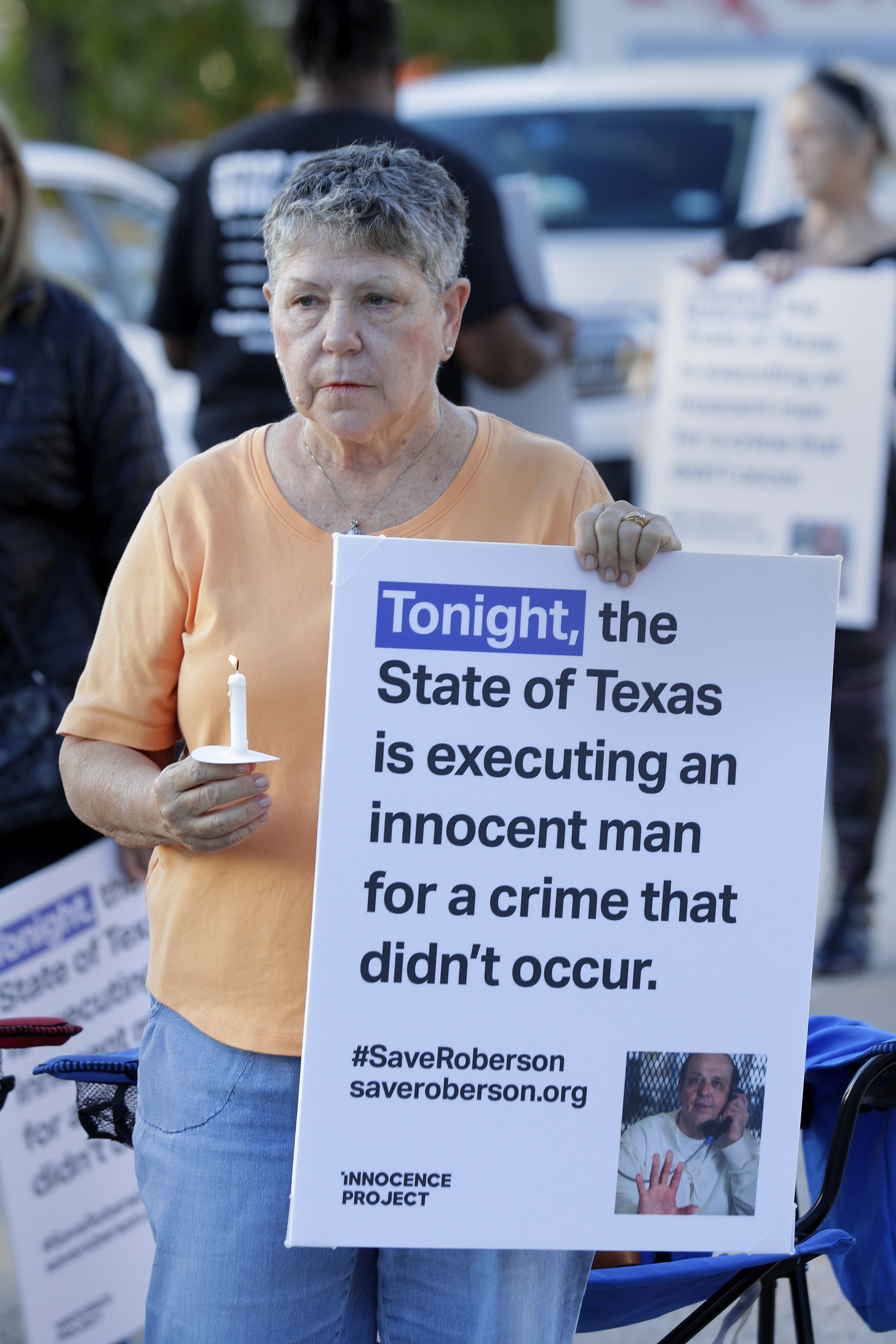 Ann Dorn, a local Catholic parishioner opposed to the death penalty, protest outside the prison where Robert Roberson is scheduled for execution at the Huntsville Unit of the Texas State Penitentiary, Thursday, Oct. 17, 2024, in Huntsville, Texas. (AP Photo/Michael Wyke)