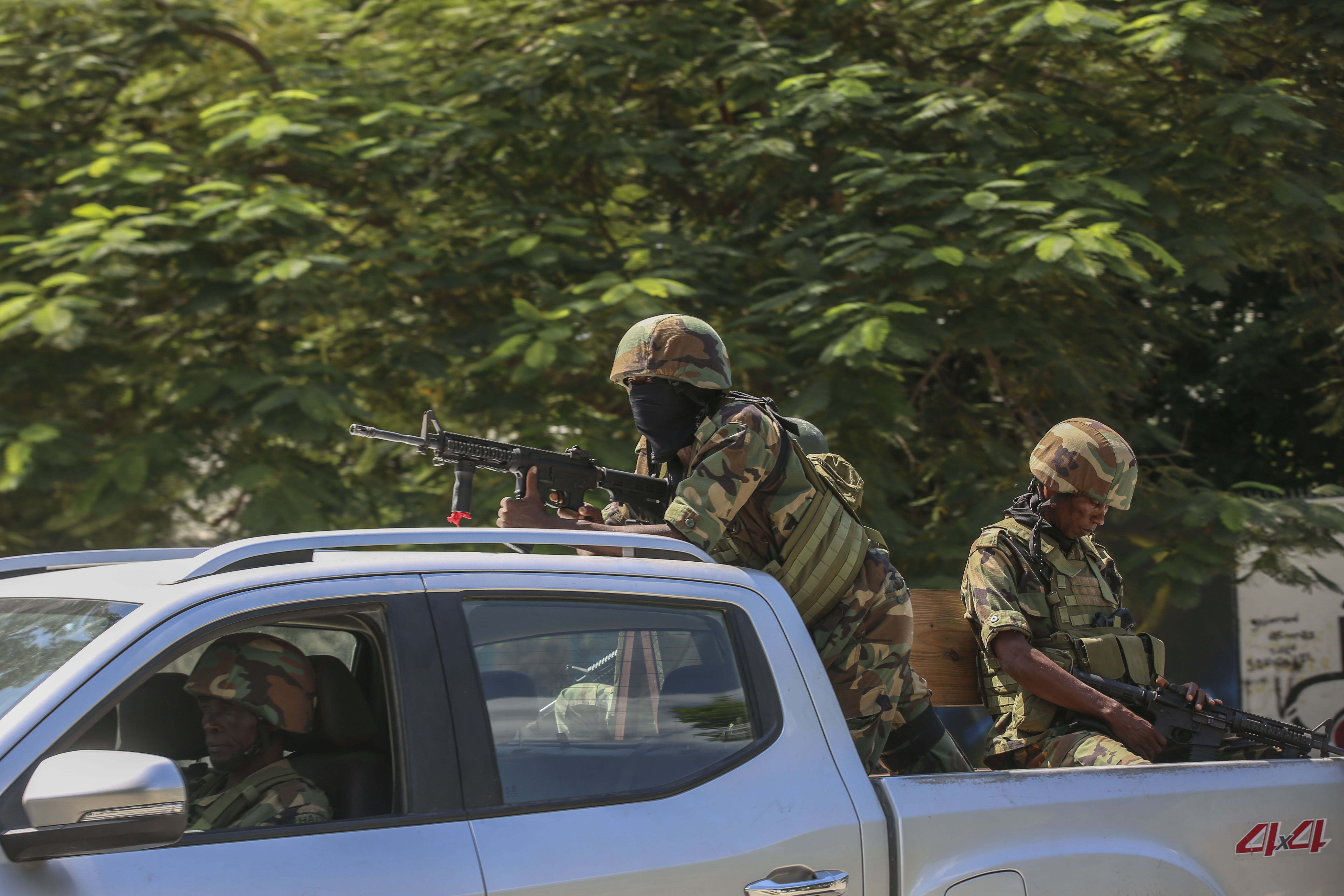 Soldiers patrol amid the sound of gunshots heard in the distance, in Port-au-Prince, Haiti, Thursday, Oct. 17, 2024. (AP Photo/Odelyn Joseph)