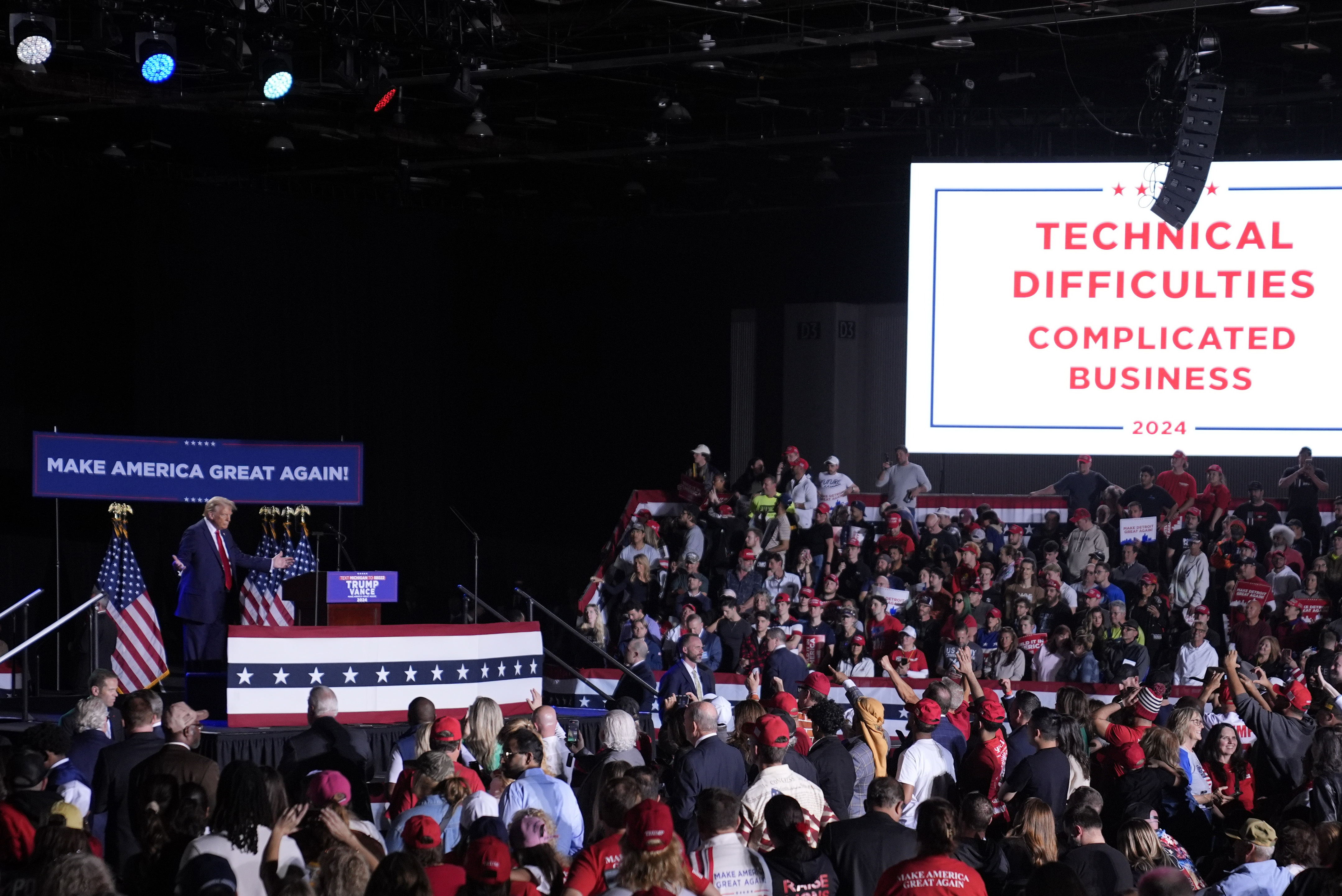 Republican presidential nominee former President Donald Trump pauses during technical difficulties at a campaign rally, Friday, Oct. 18, 2024, in Detroit. (AP Photo/Evan Vucci)