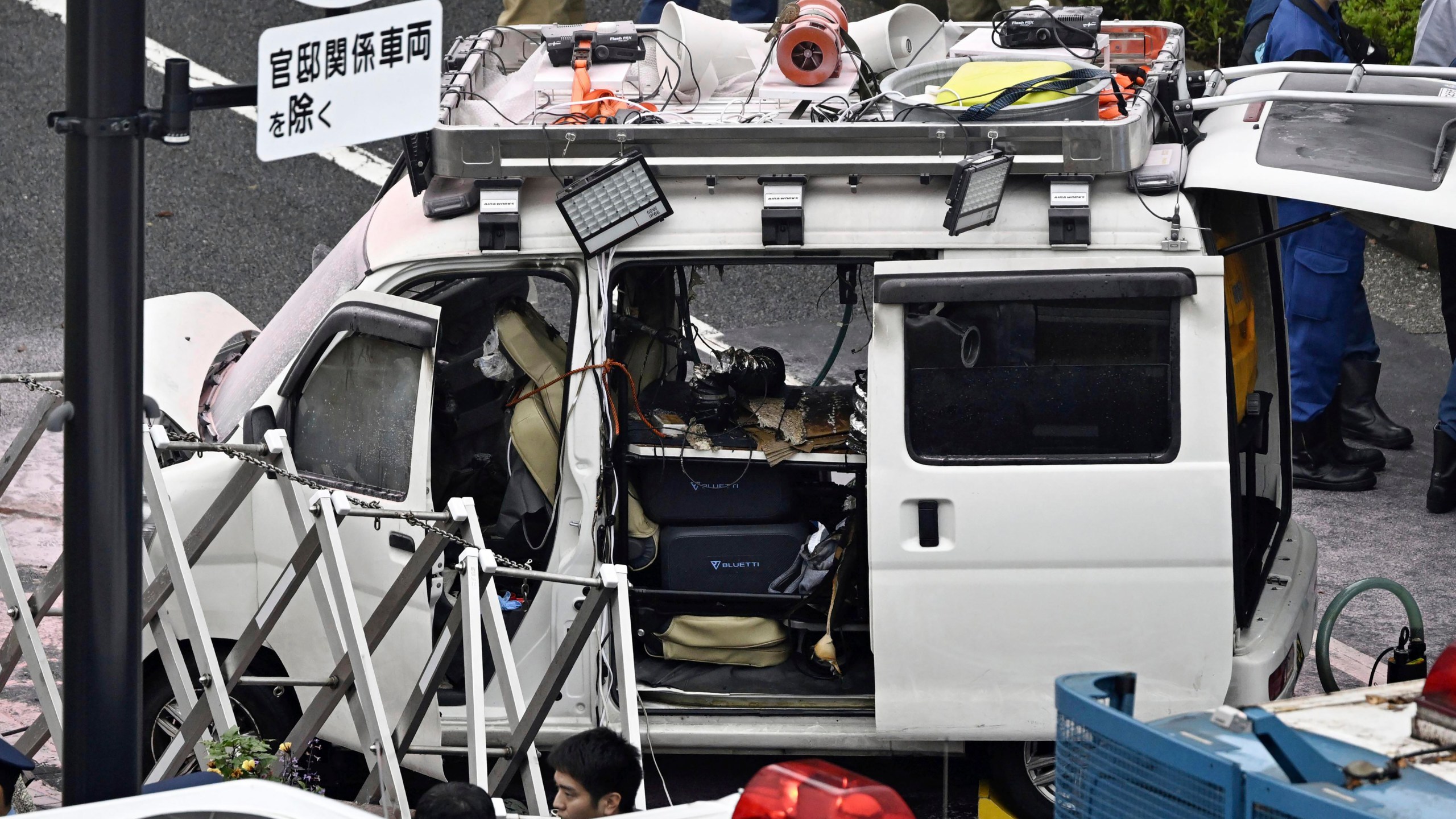 A vehicle is stuck against a barricade near the prime minister's office in Tokyo Saturday, Oct. 19, 2024. (Kyodo News via AP)