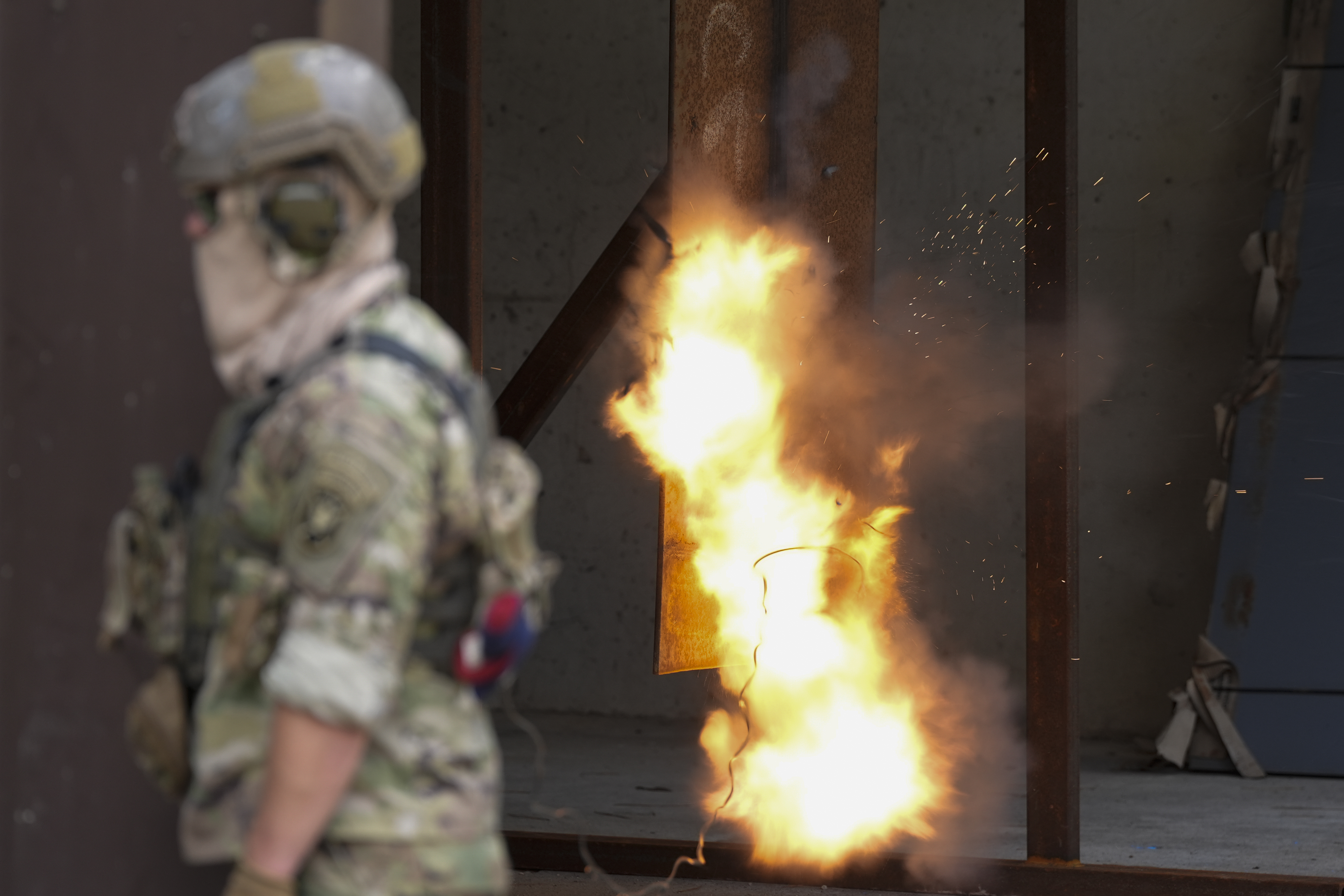 A U.S. special forces soldier sets off a reshaped explosive charge that's noticeably smaller to reduce its blowback on troops, Thursday, Sept. 19, 2024, at at Fort Liberty in Fayetteville, N.C. Special Operations Command is developing ways to better protect warfighters and evaluate their health risks, particularly during training. (AP Photo/Chris Carlson)