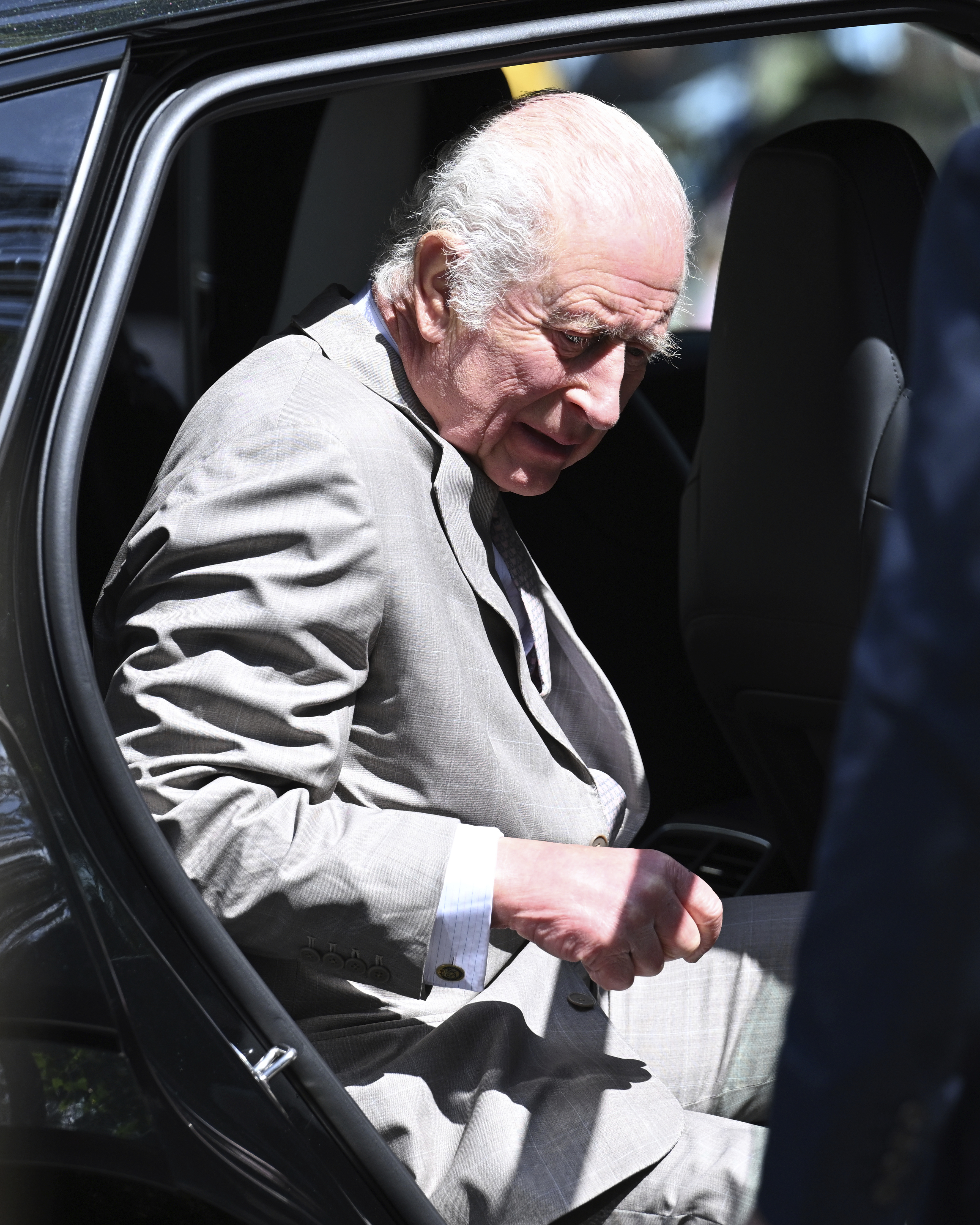 King Charles III exits a car as he arrives with Queen Camilla for a visit to St Thomas' Anglican Church in Sydney, Sunday, Oct. 20, 2024. (Dean Lewins/Pool Photo via AP)