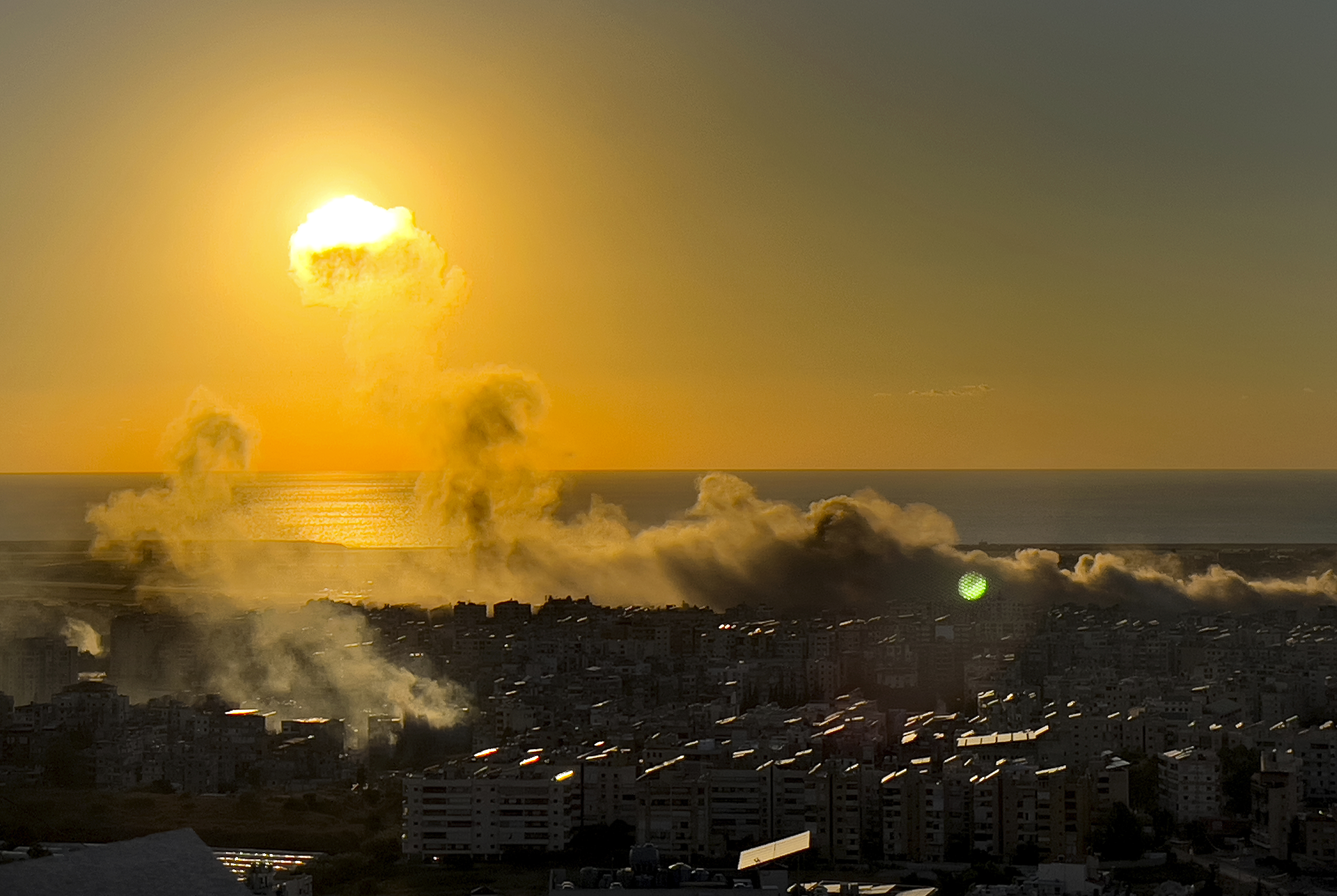 Smoke rises from Israeli airstrikes on Dahiyeh, as the sunset in the southern suburb of Beirut, Lebanon, Saturday, Oct. 19, 2024. (AP Photo/Hussein Malla)