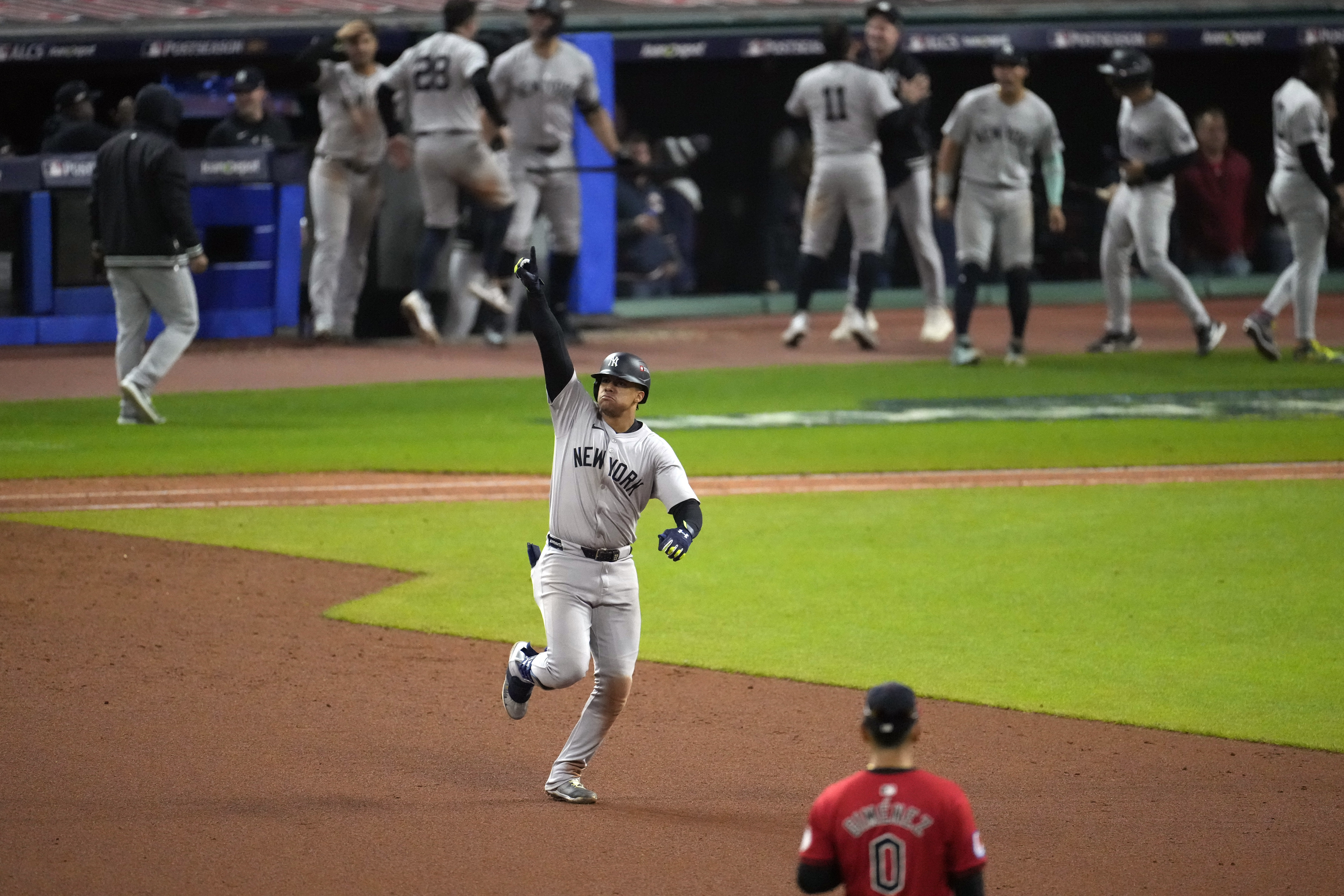 New York Yankees' Juan Soto celebrates after hitting a three-run home run against the Cleveland Guardians during the 10th inning in Game 5 of the baseball AL Championship Series Saturday, Oct. 19, 2024, in Cleveland. (AP Photo/Jeff Roberson)