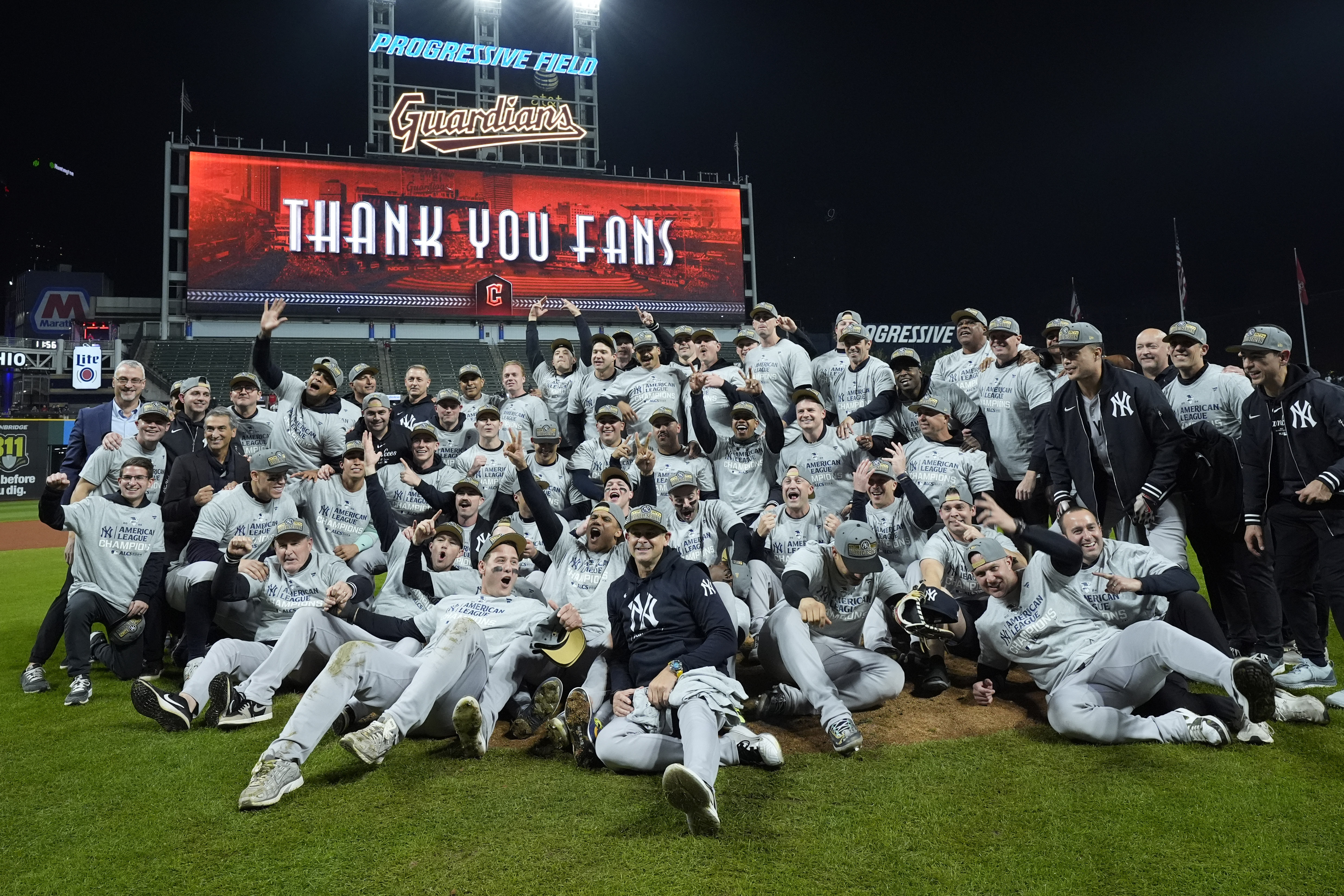 The New York Yankees pose for a team picture after Game 5 of the baseball AL Championship Series against the Cleveland Guardians Saturday, Oct. 19, 2024, in Cleveland. The Yankees won 5-2 to advance to the World Series. (AP Photo/Godofredo A. Vásquez )