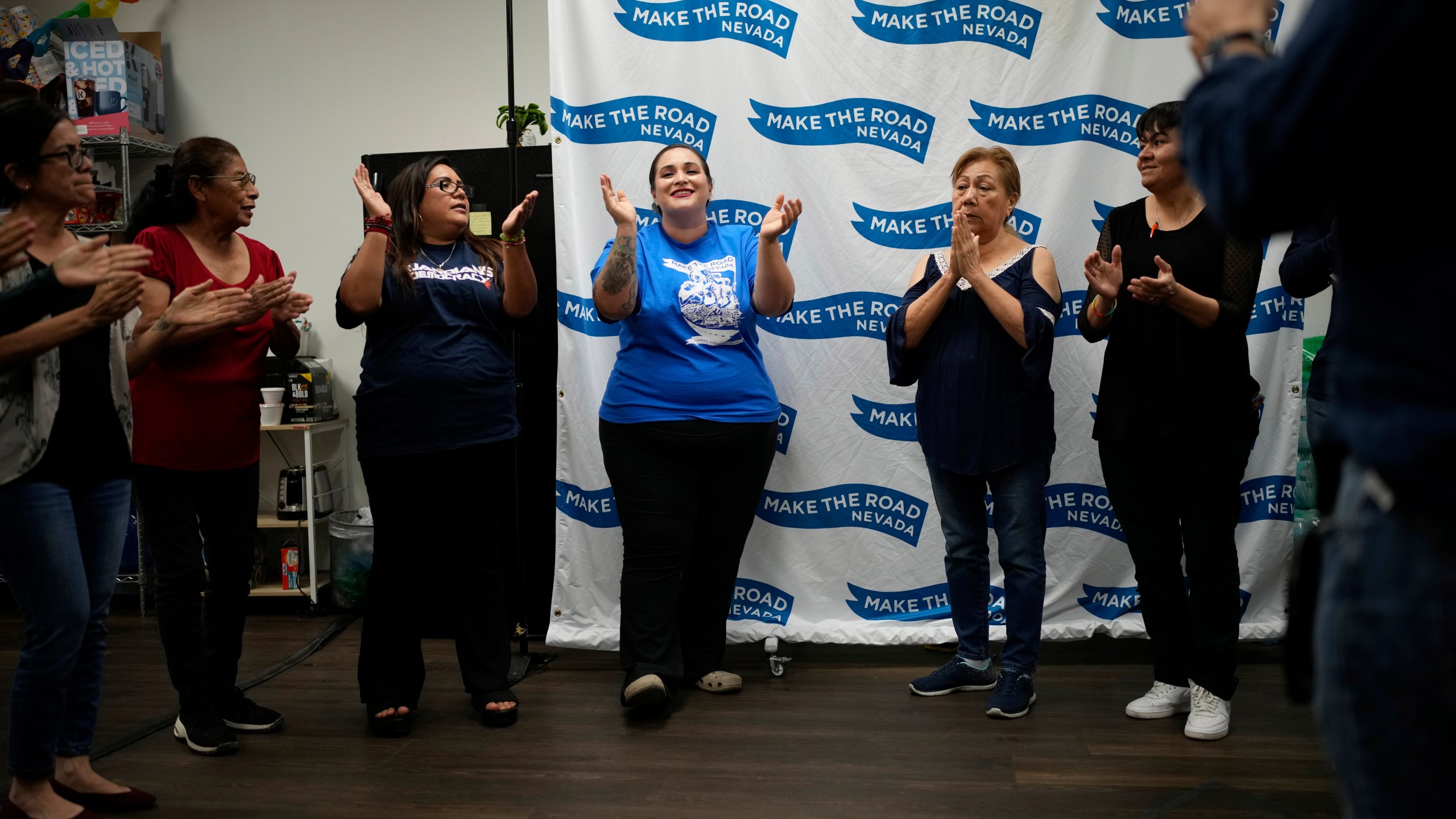 Erika Marquez, center, leads a meeting at the nonprofit Make the Road Nevada, where she works as the immigration and justice organizer, Thursday, Sept. 12, 2024, in Las Vegas. Marquez is a recipient of an Obama administration amnesty for immigrants brought to the U.S. illegally as children. (AP Photo/John Locher)