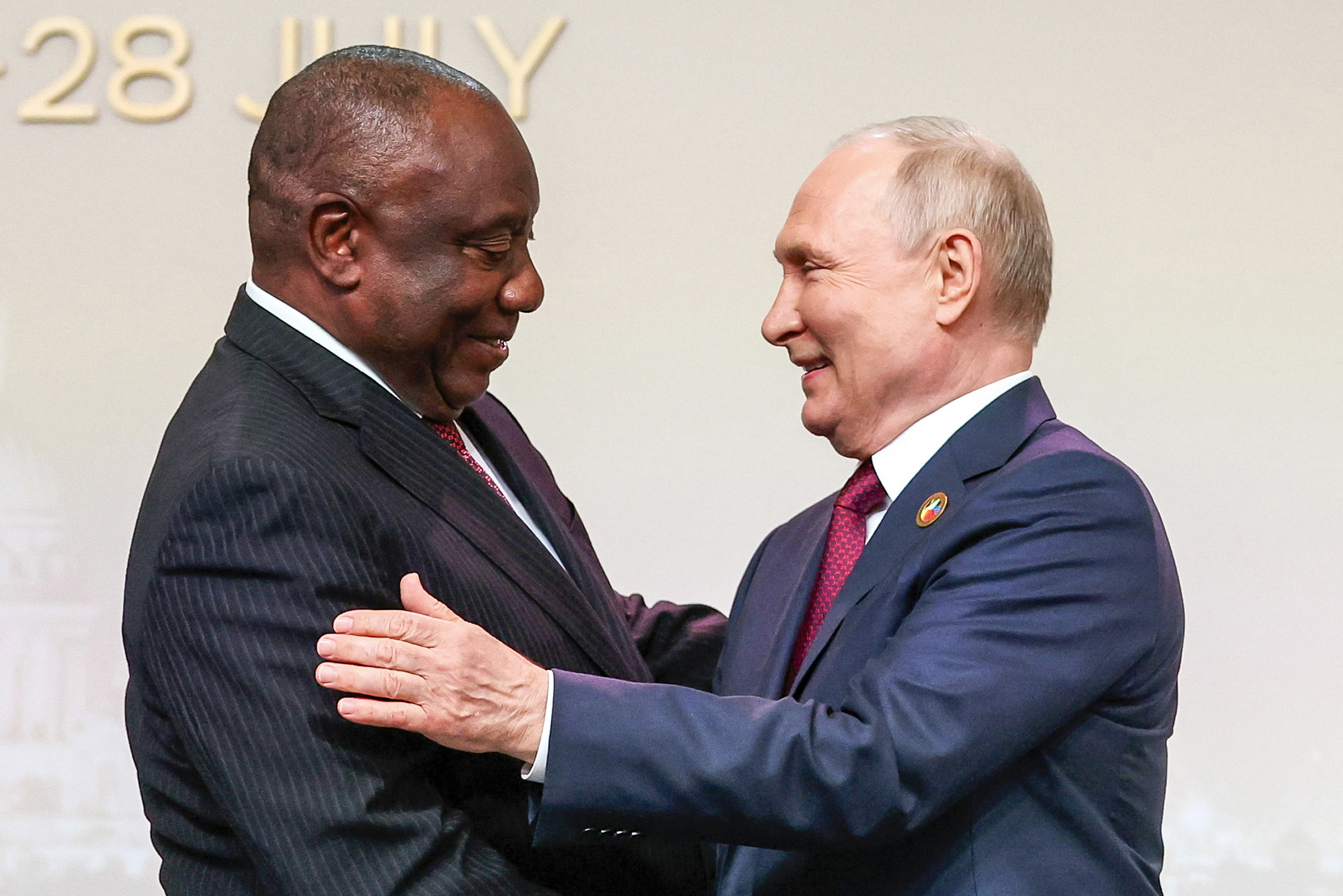 FILE – South African President Cyril Ramaphosa, left, and Russian President Vladimir Putin shake hands in St. Petersburg, Russia, on Thursday, July 27, 2023. (Sergei Bobylev/TASS Host Photo Agency Pool Photo via AP, File)